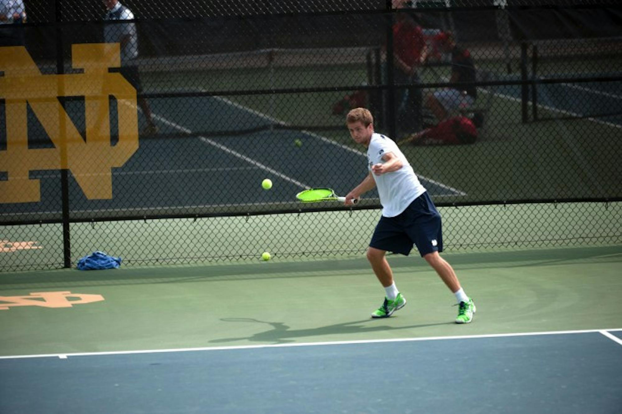 Irish senior Quentin Monaghan attempts a forehand during Notre Dame’s 4-3 win over North Carolina State on April 18 at Courtney Tennis Center. Monaghan won his only singles match Saturday.