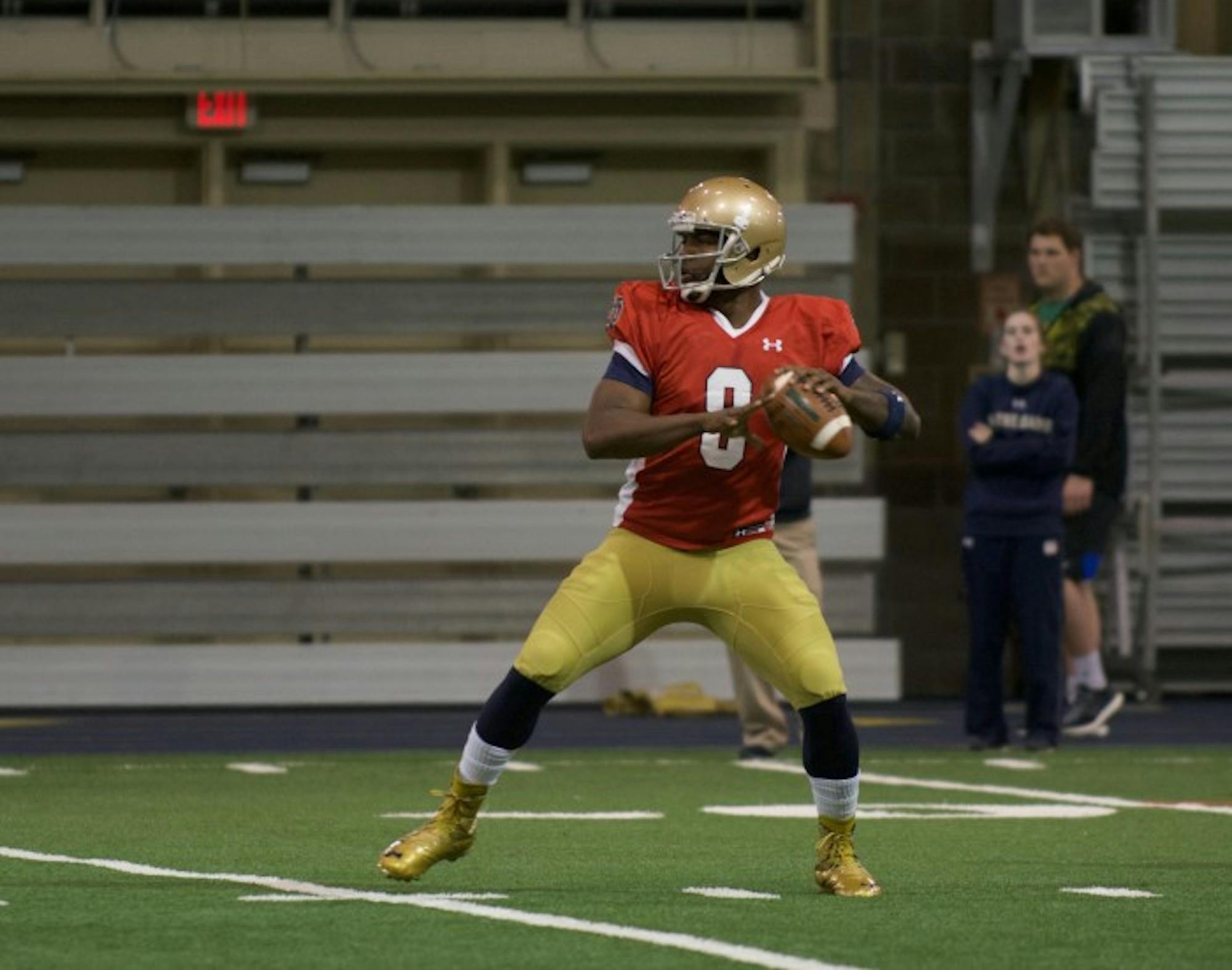 Senior quarterback Malik Zaire drops back to pass during a practice on Tuesday morning at Loftus Sports Center.