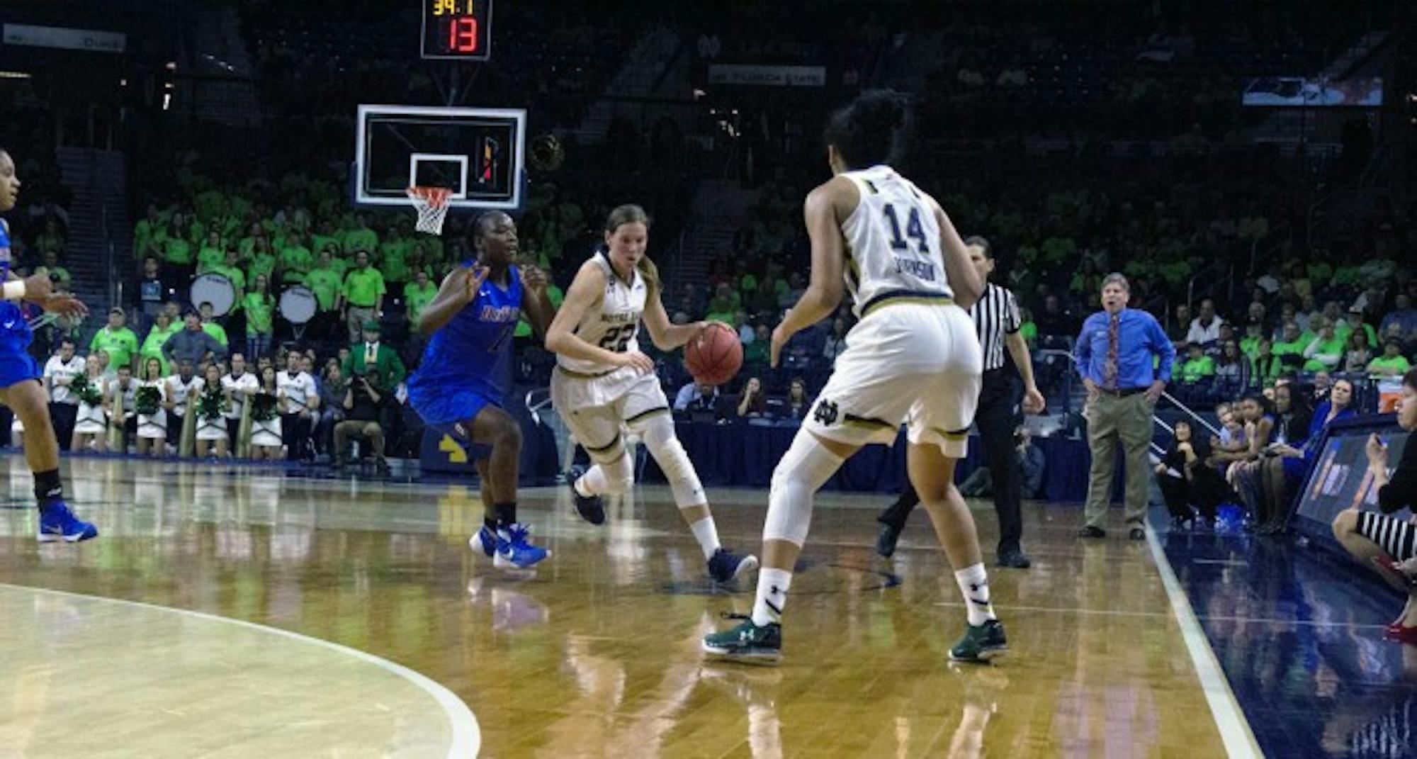Graduate student guard Madison Cable pushes the ball upcourt past a DePaul defender during Notre Dame’s 95-90 victory over the Blue Demons on Wednesday night at Purcell Pavilion. Cable led the Irish with 21 points.