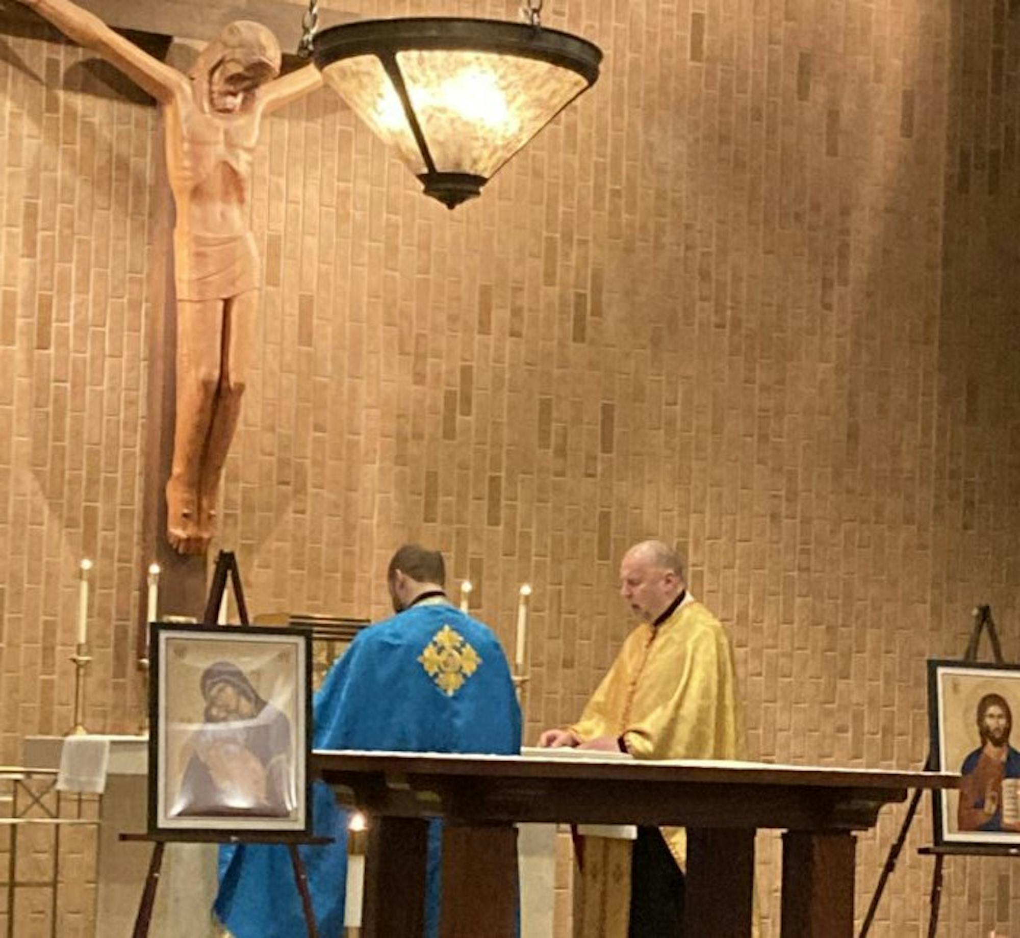 priests presiding over a prayer vigil for Ukraine