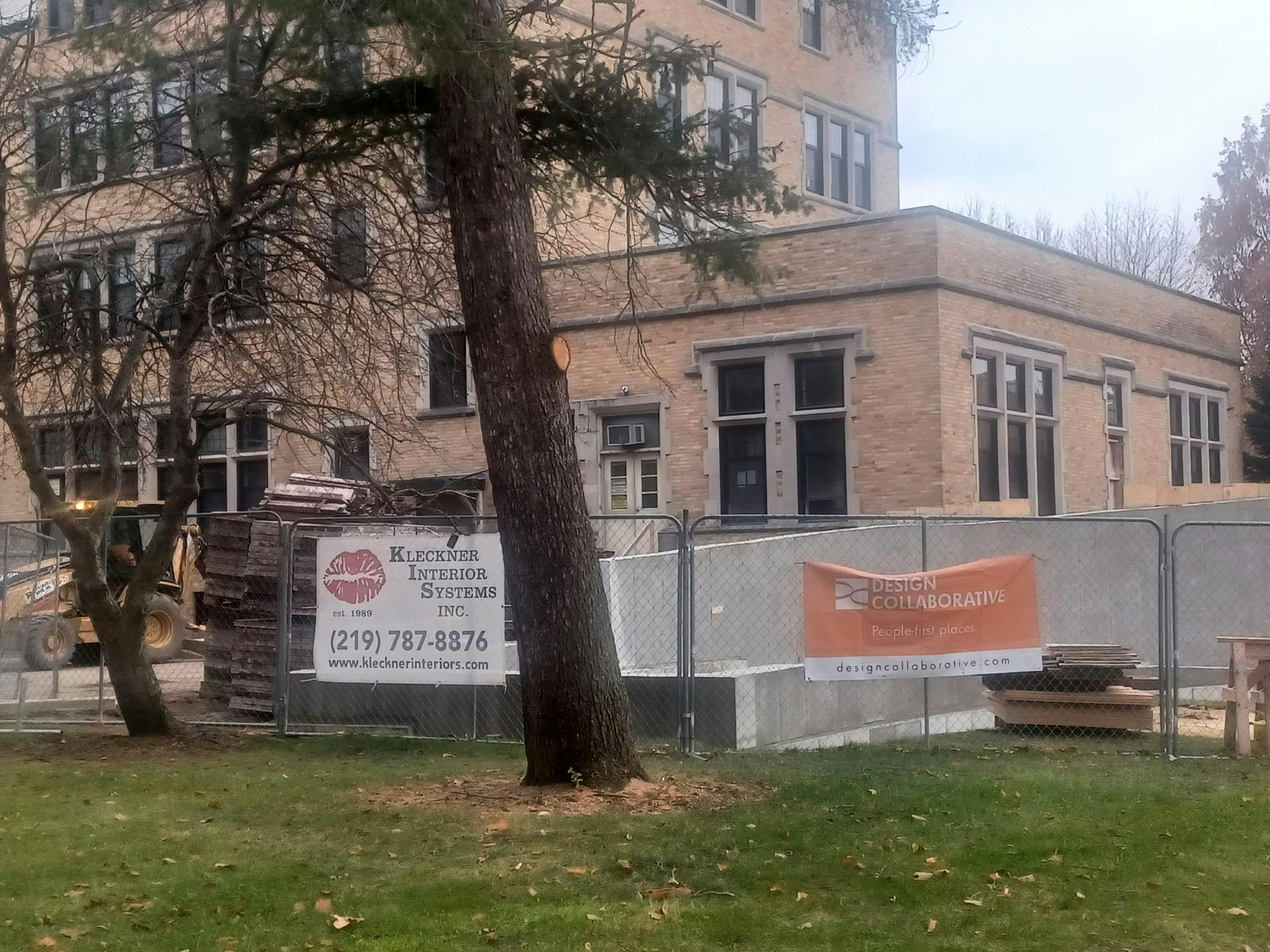 Construction and design companies' posters seen on fence of construction.jpg