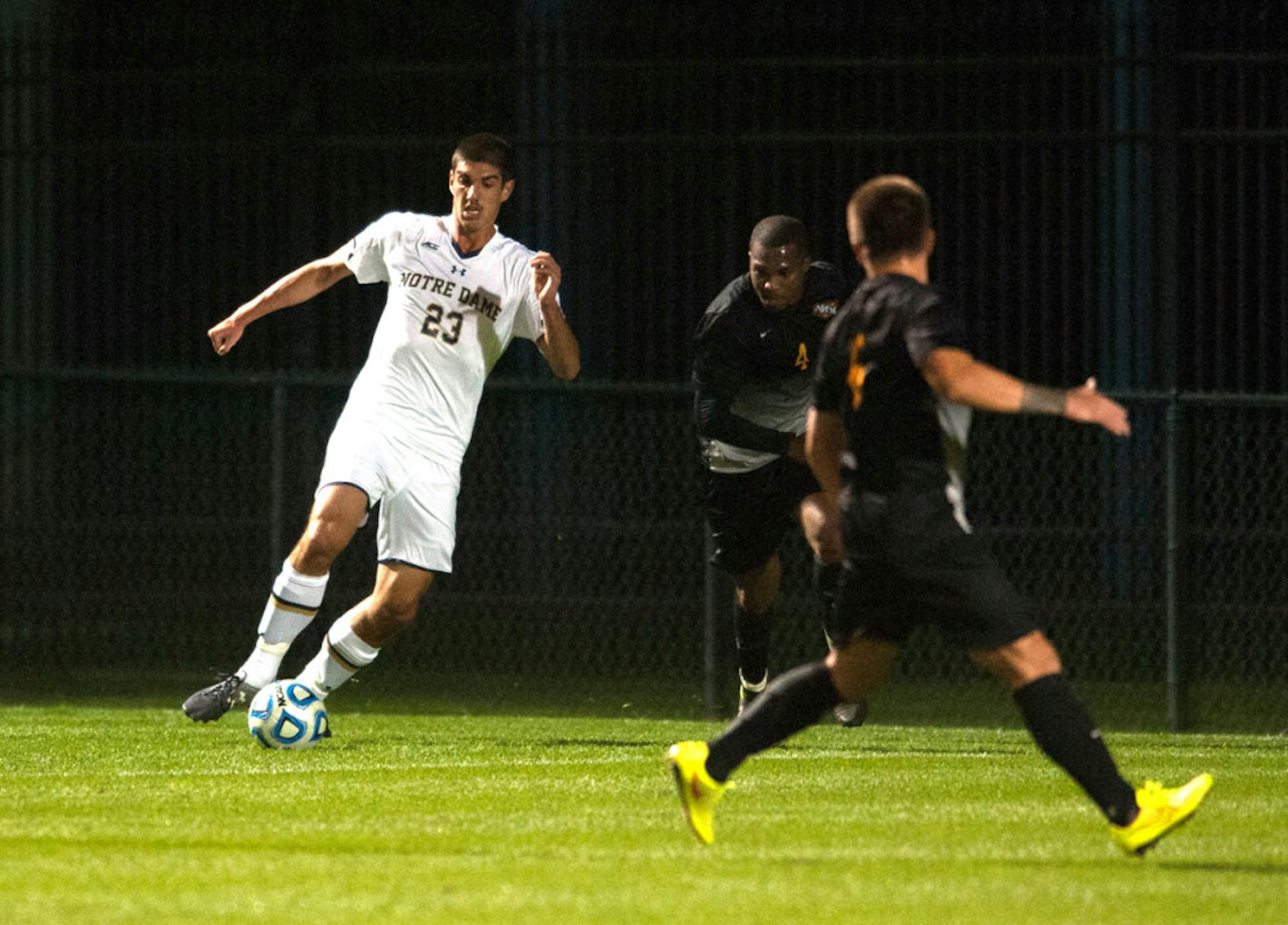 Irish freshman forward Jeffrey Farina protects the ball from a VCU defender Sept. 30 at Alumni Stadium. Notre Dame won the match 1-0 in double overtime. Farina has two goals and six assists this year.