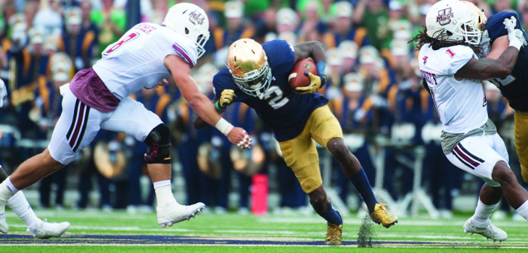 Senior receiver Chris Brown tries to power past Massachusetts redshirt sophomore linebacker Shane Huber during Notre Dame’s 62-27 victory over the Minutemen last Saturday at Notre Dame Stadium.
