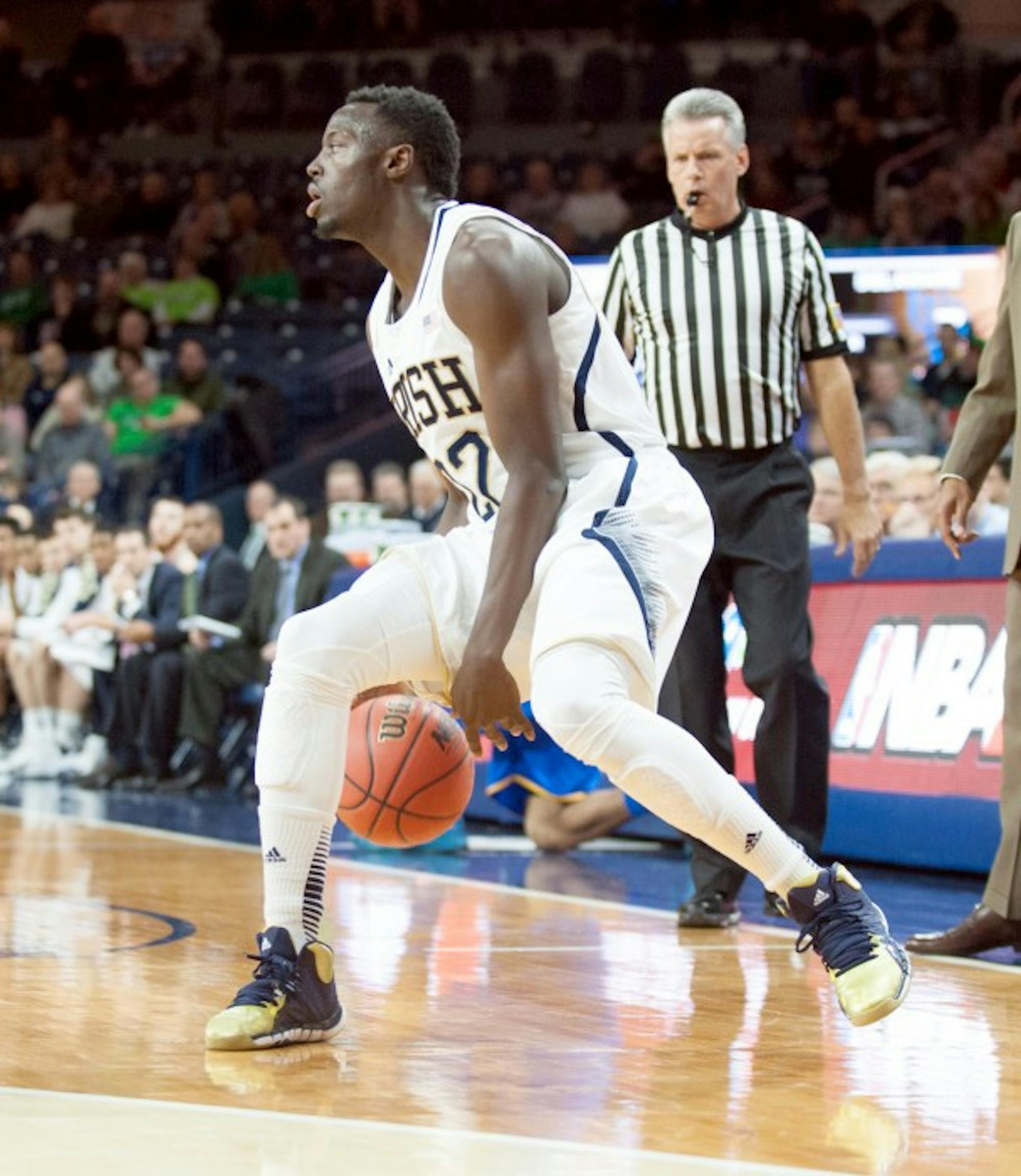 Irish senior guard Jerian Grant dribbles down the sideline during Notre Dame's 80-75 victory over Delaware on Dec. 7.