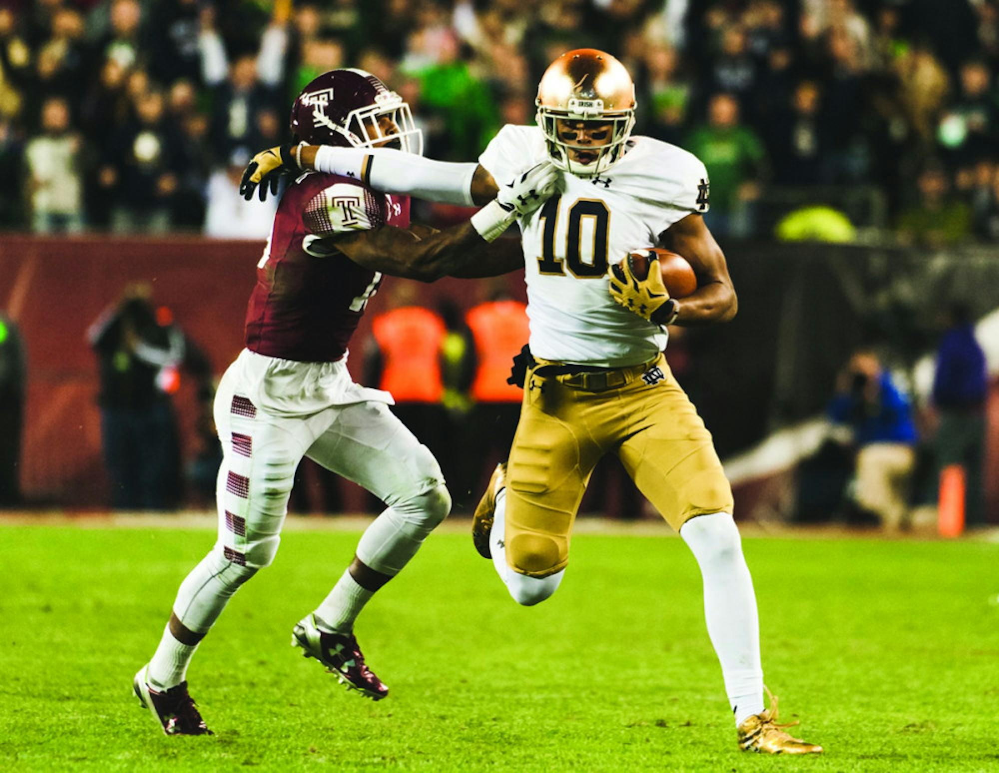 Irish freshman tight end Alizé Jones tries to push off a Temple defender on a 45-yard reception in Notre Dame’s 24-20 victory over the Owls last Saturday at Lincoln Financial Field in Philadelphia.