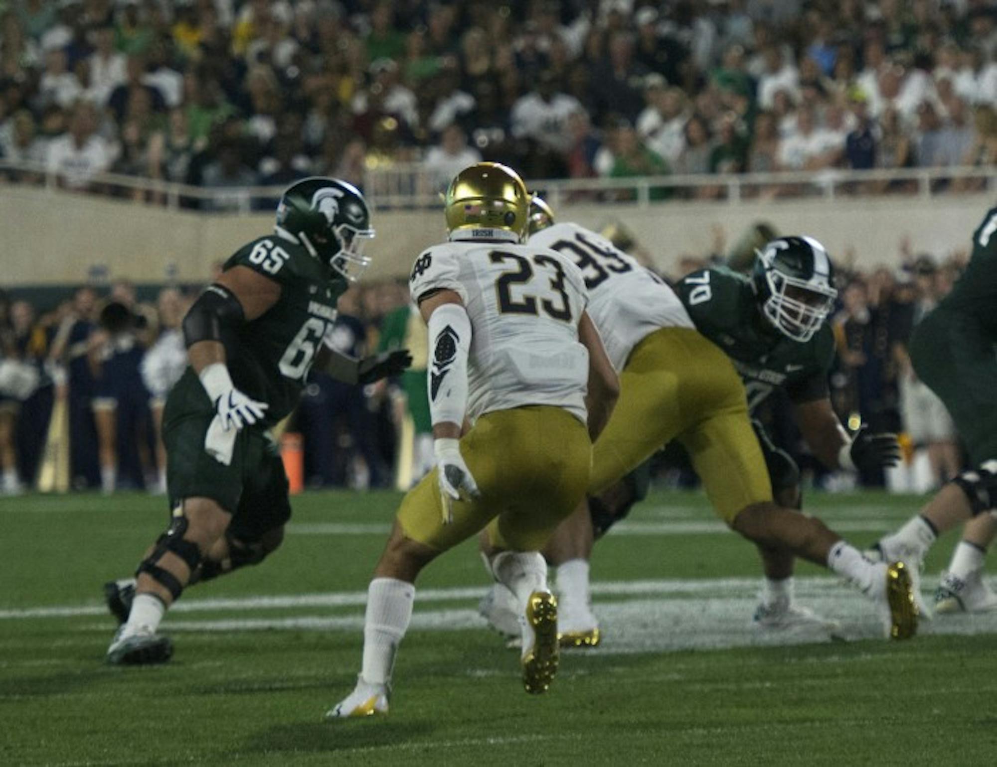 Irish senior linebacker Drue Tranquill reads the offense and looks to attack the line of scrimmage during Notre Dame’s 38-18 win over Michigan State on Saturday at Spartan Stadium.