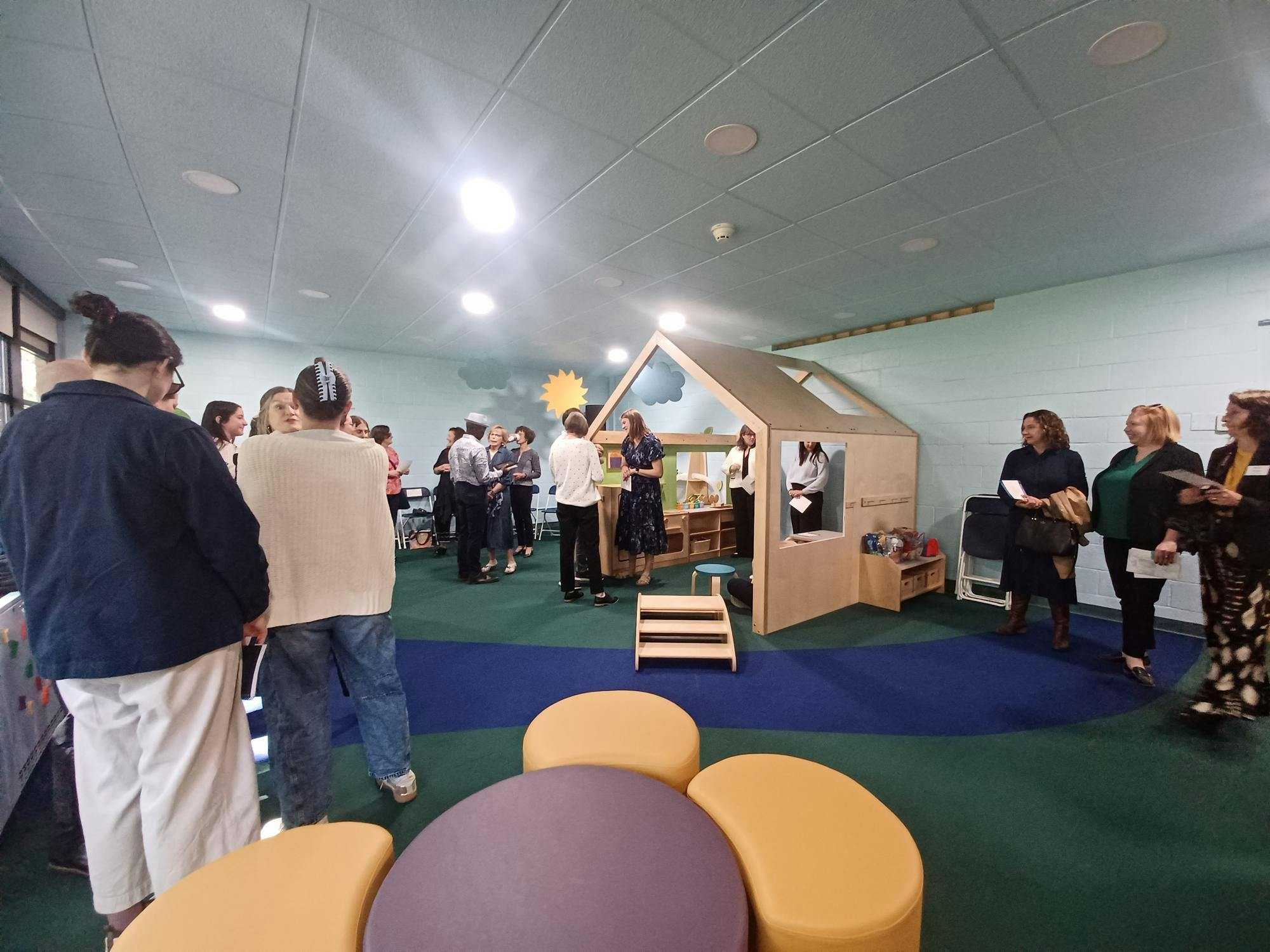 Students and faculty gather inside Language and Literacy Lab