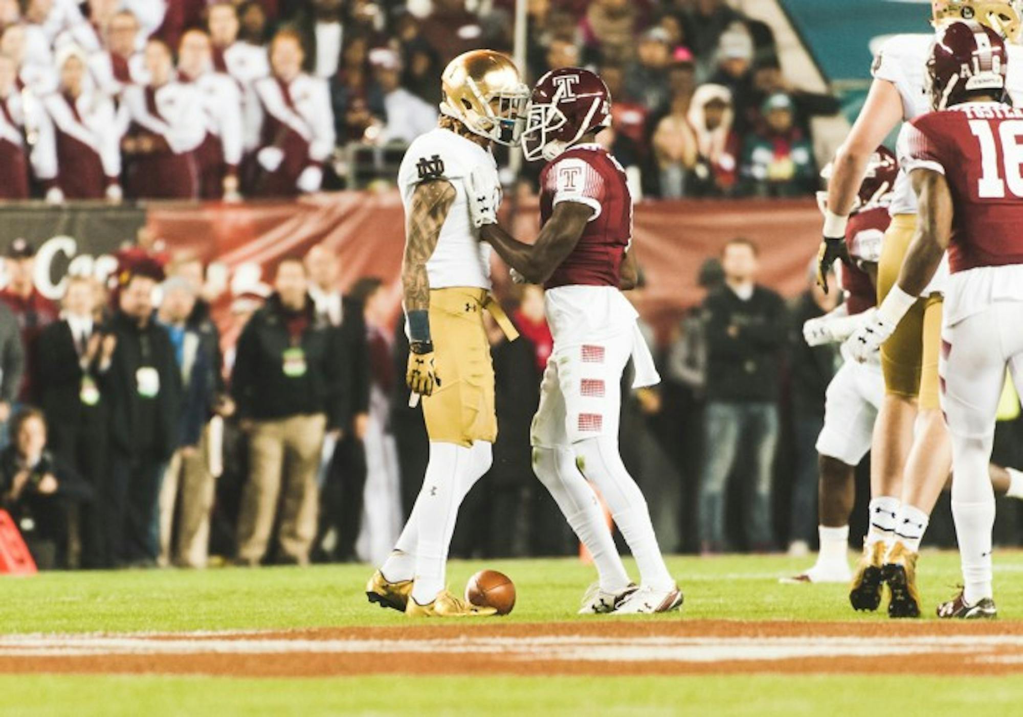 Irish junior receiver Will Fuller and Temple senior defensive back Tavon Young exchange words.