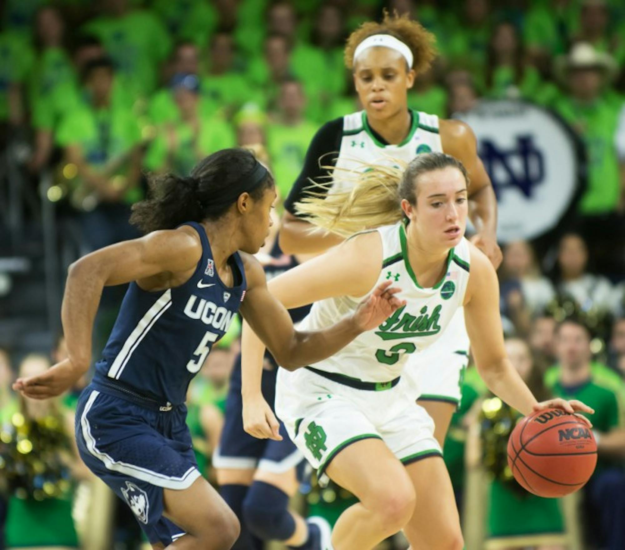 Irish sophomore guard Marina Mabrey attempts to dribble by a UConn defender in Notre Dame's loss to the Huskies on Wednesday at Purcell Pavilion.
