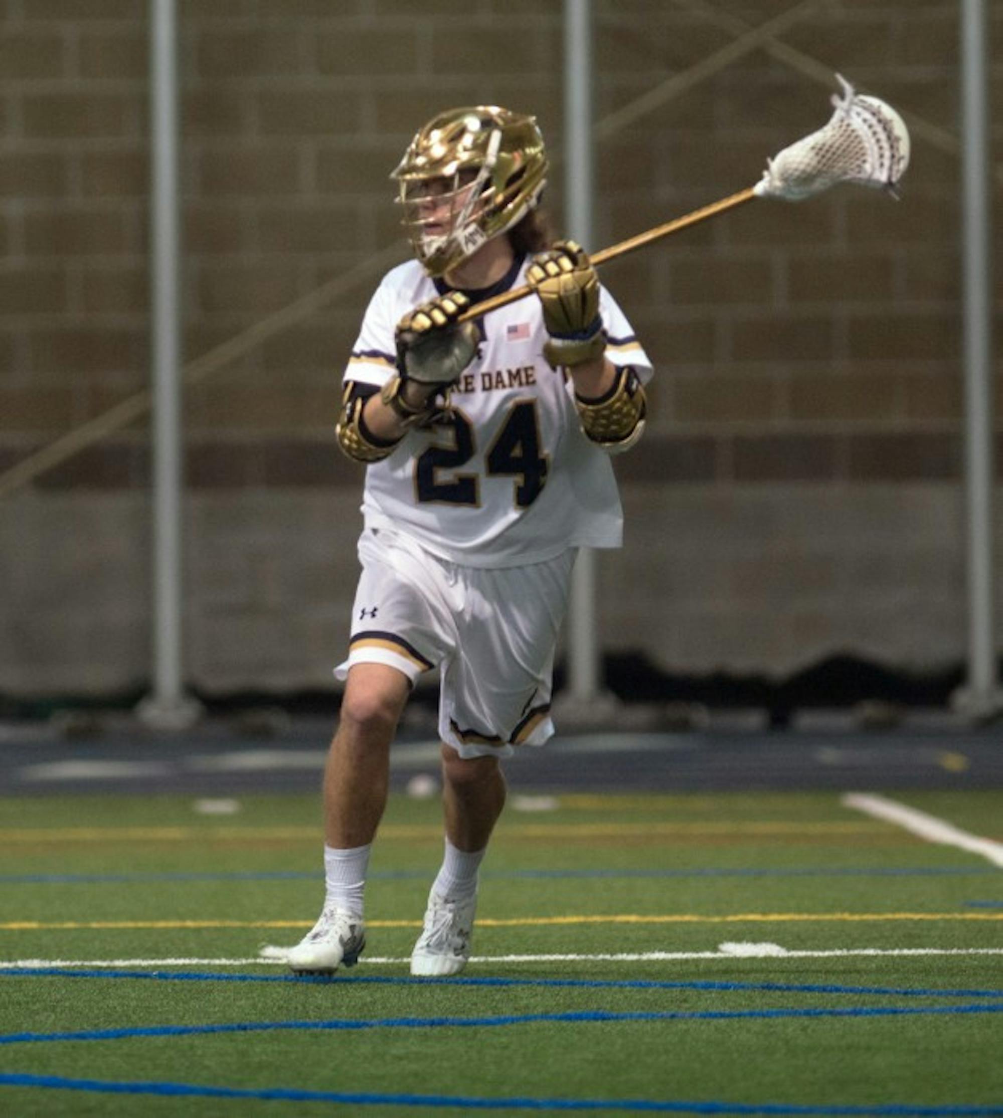Sophomore attack Mikey Wynne looks to pass in Notre Dame’s 14-5 win over Detroit at Loftus Sports Center. Wynne scored a career-high six goals in the game.