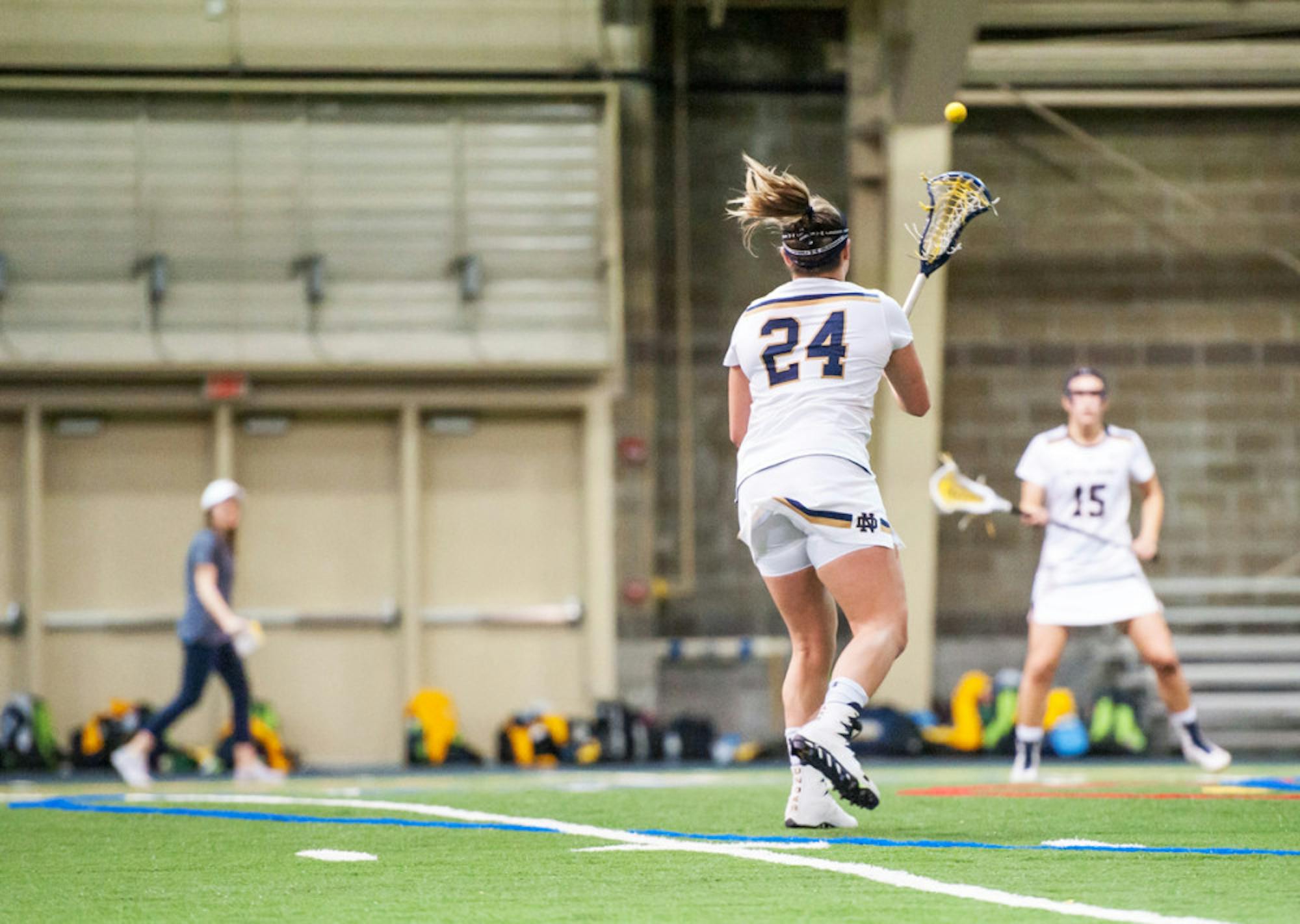 Irish senior midfielder Casey Pearsall fires a pass across the field during Notre Dame's 21-9 win over Marquette at Loftus Sports Center on Feb. 14.