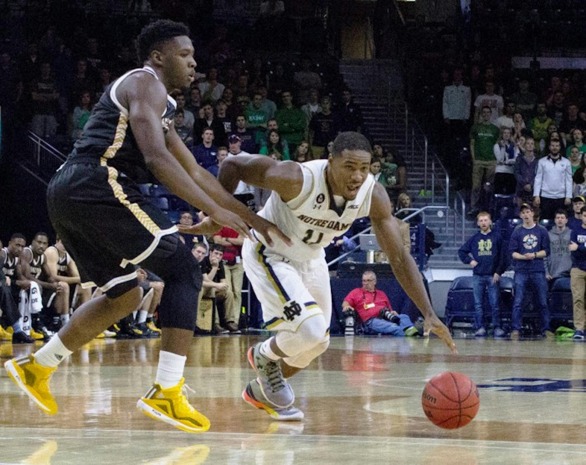 Junior guard Demitrius Jackson dribbles around a defender during Notre Dame’s 86-78 victory over  Milwaukee on Nov. 17. Jackson led the team with 20 points in the win.