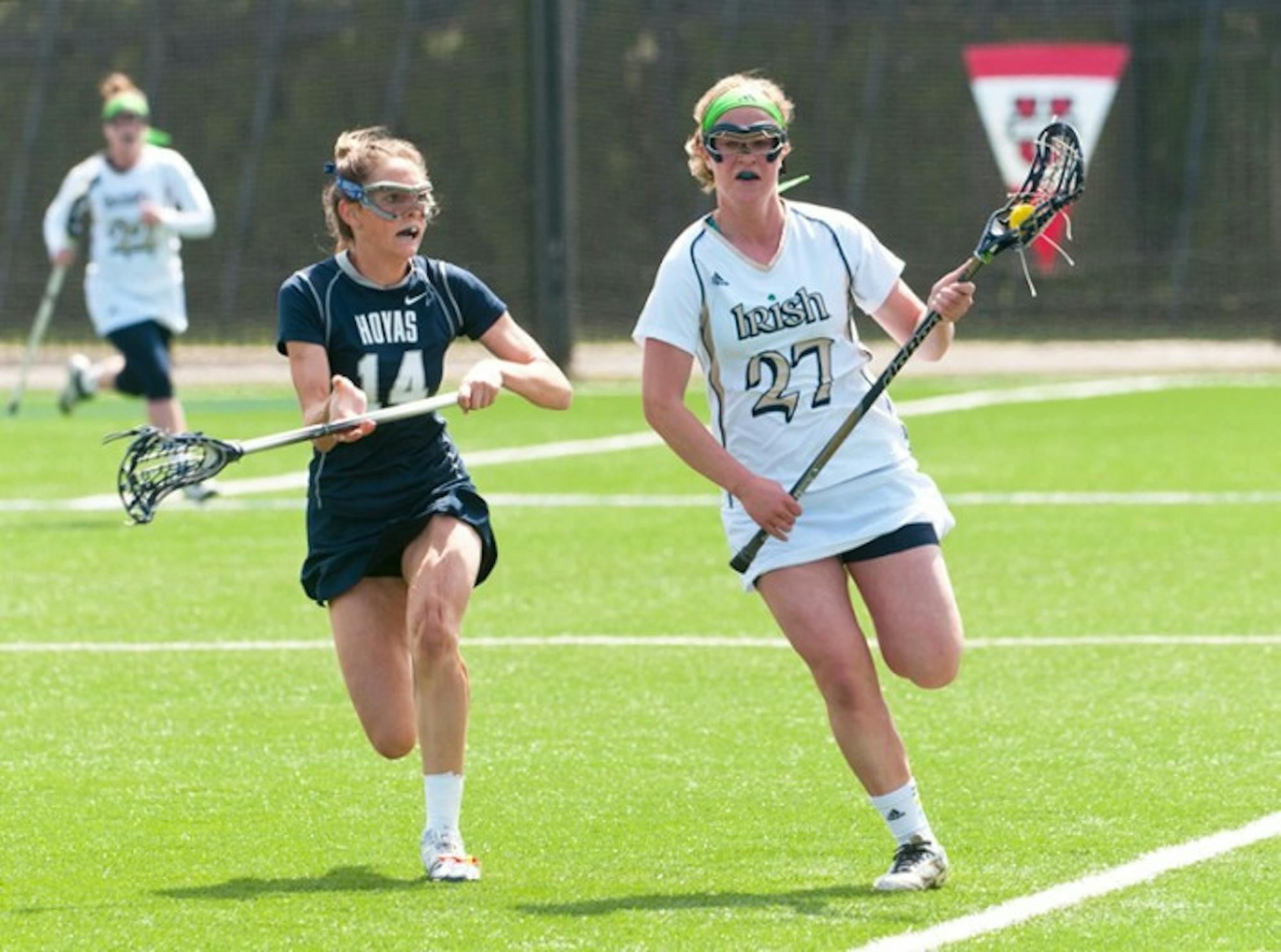Irish senior defender Molly Shawhan sprints past a Georgetown defender in Notre Dame’s 13-12 victory over the Hoyas last season on April 14. Shawhan was recently named a co-captain for the upcoming season.
