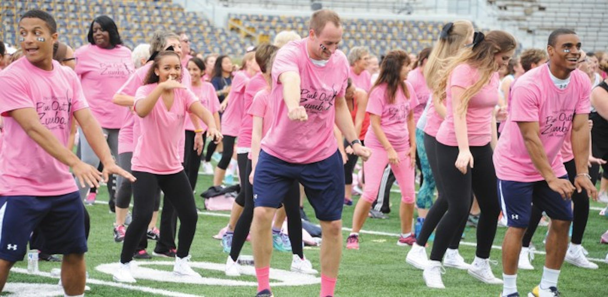 Pink Out Zumba participants take a Zumba class sponsored by the Kelly Cares Foundation, which aims to raise awareness about pertinent health and education issues.