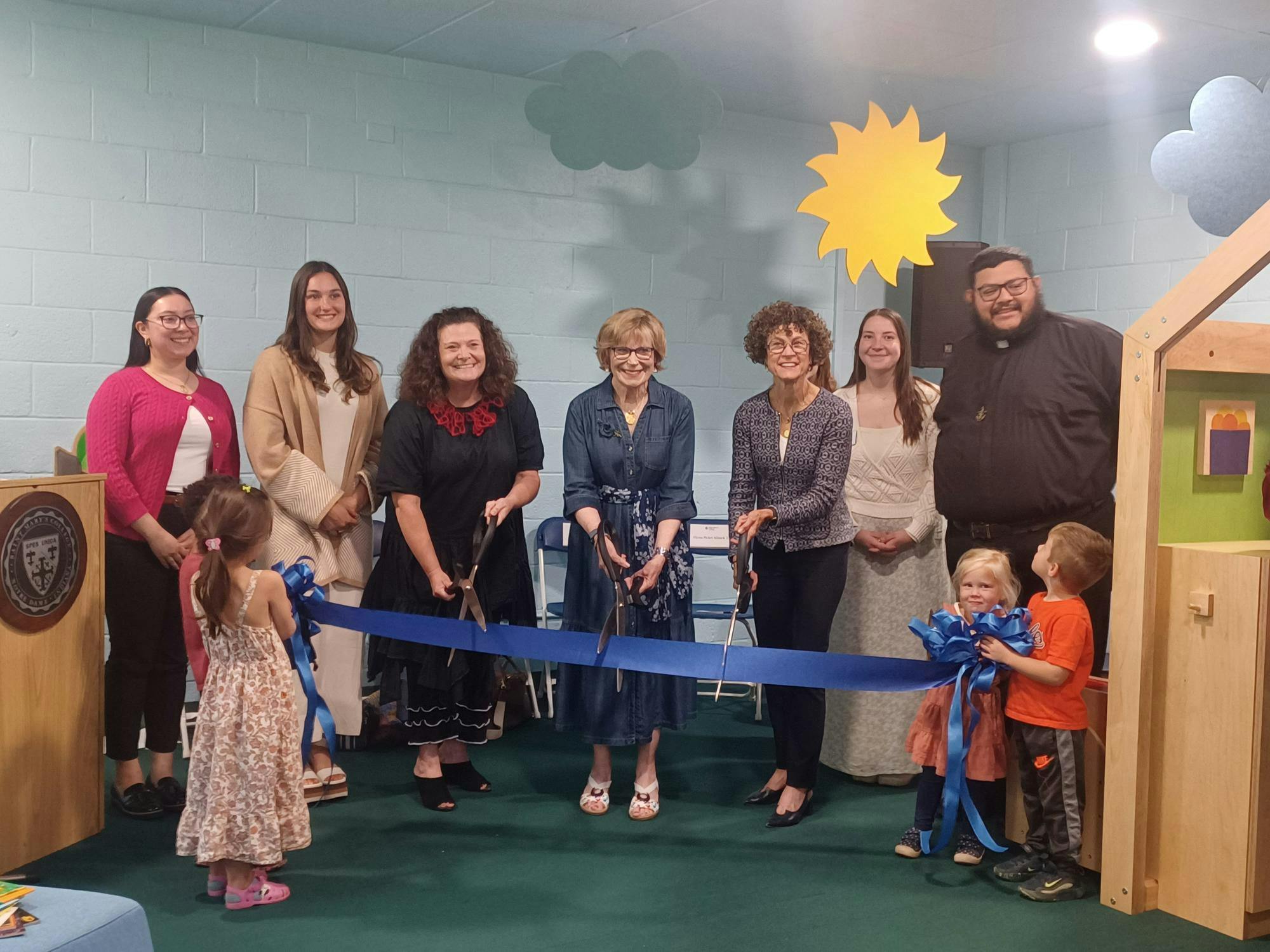 Faculty and students cut ribbon for lab open house