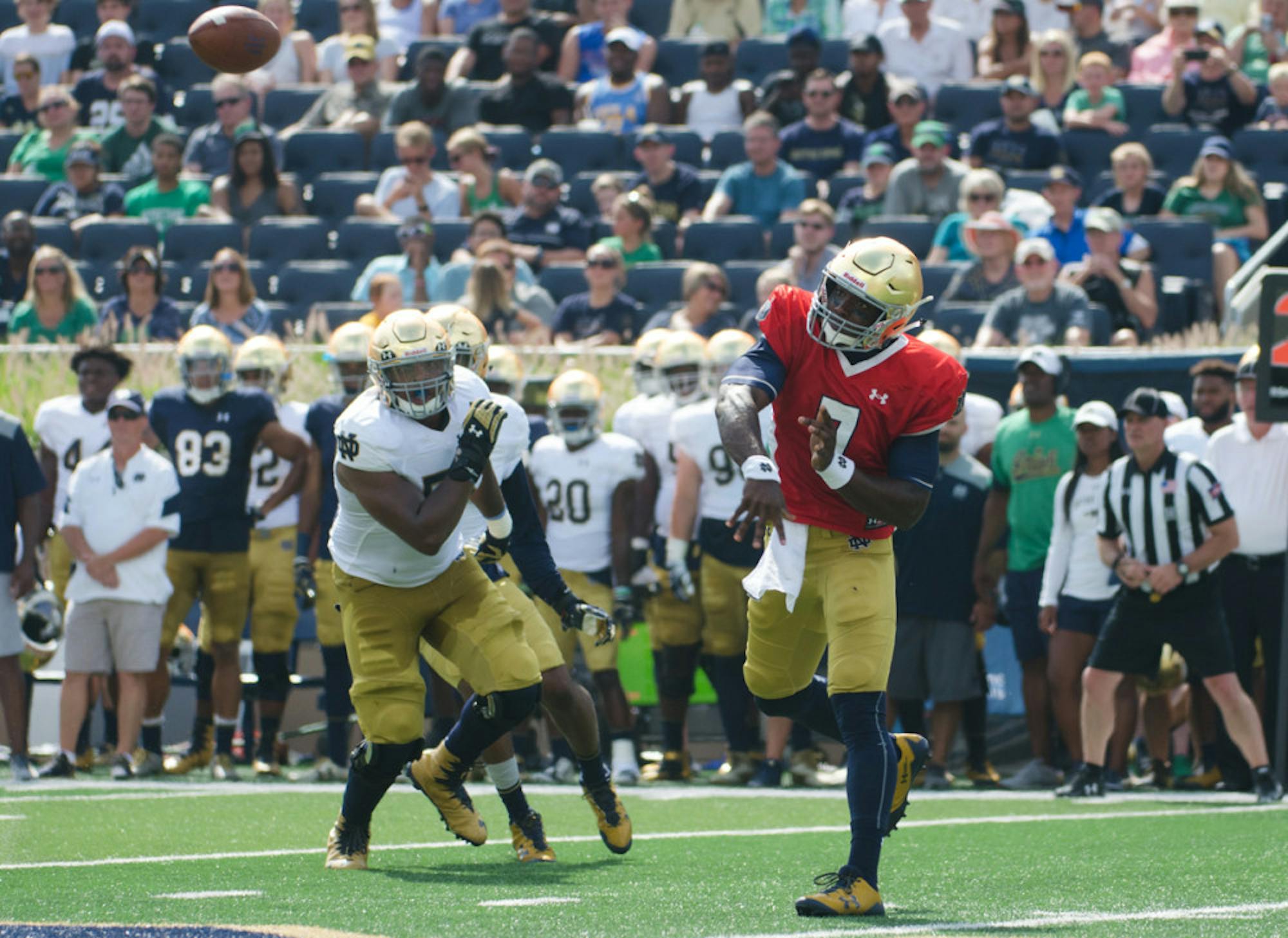 Junior quarterback Brandon Wimbush follows through after firing a pass across the field during Notre Dame’s New and Gold scrimmage Aug. 20 at Notre Dame Stadium. Wimbush played in two games as a freshman in 2015 while serving as DeShone Kizer’s backup.