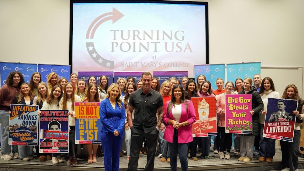 Turning Point USA members and board with speaker