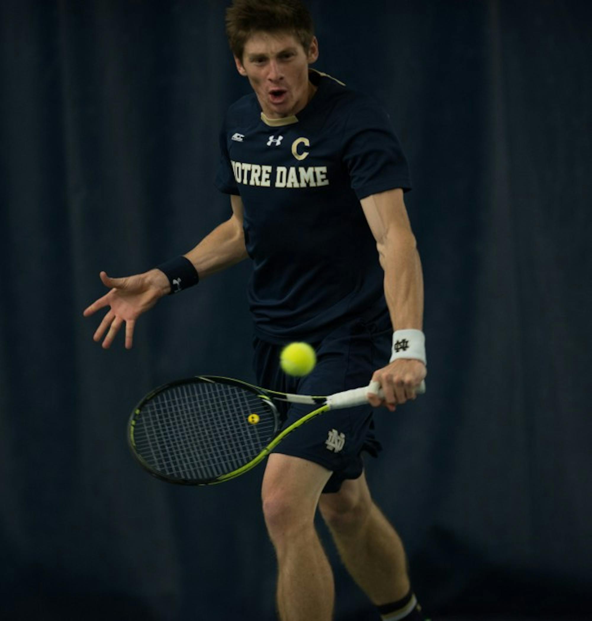 Junior Alex Lawson strikes the ball during Notre Dame's 4-3 win over Oklahoma State on Jan. 24 at Eck Tennis Pavilion. Lawson lost in three sets to Cowboys senior Nicolai Ferringo.