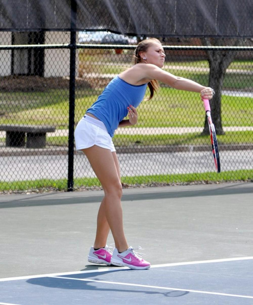 Belles junior Kayle Sexton hits a serve during Saint Mary's match against Hope on April 17.