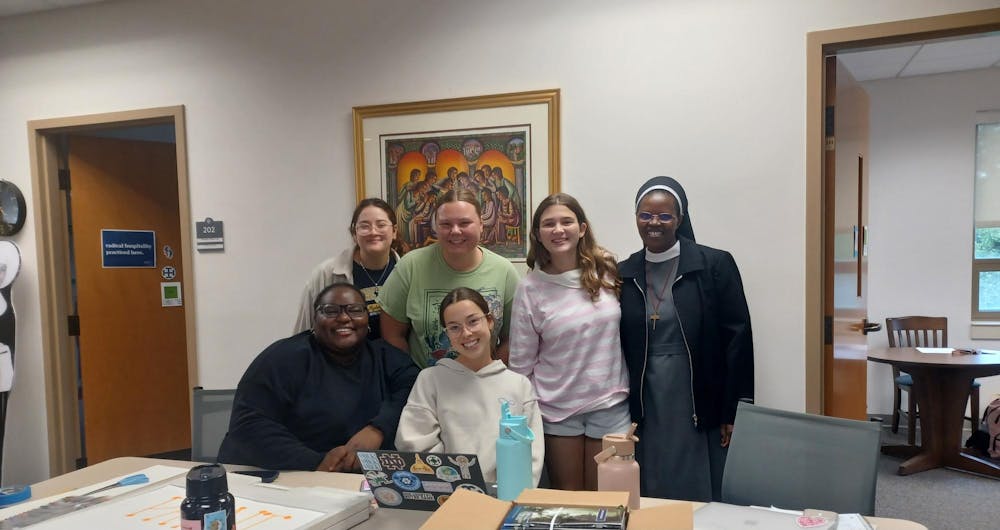 Sister Jacinta Kioko and CFAM Picture (With Students).jpg