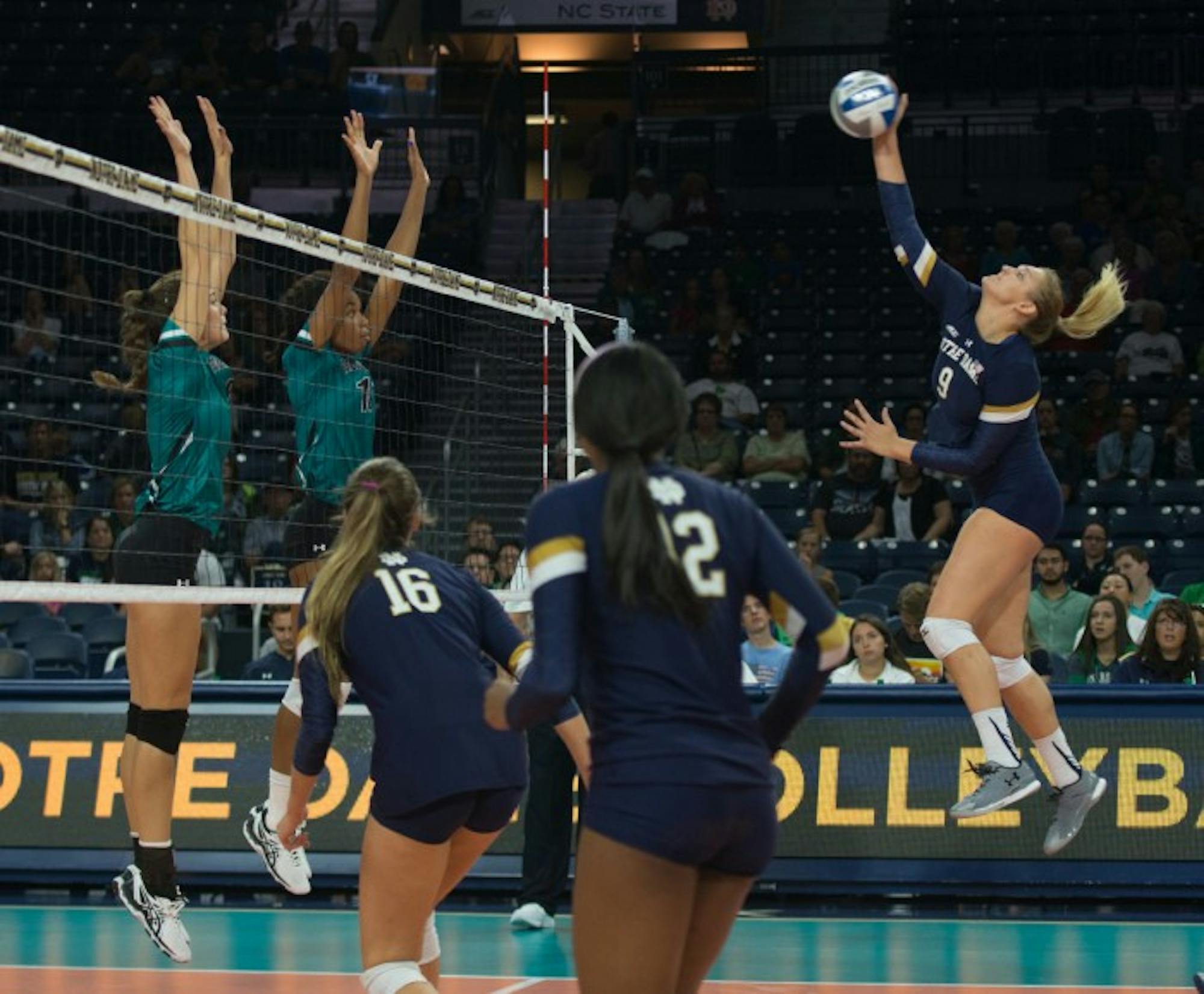 Irish sophomore outside hitter Rebecca Nunge spikes the ball during Notre Dame’s 3-0 loss to Coastal Carolina on Sept. 2 at Purcell Pavilion.
