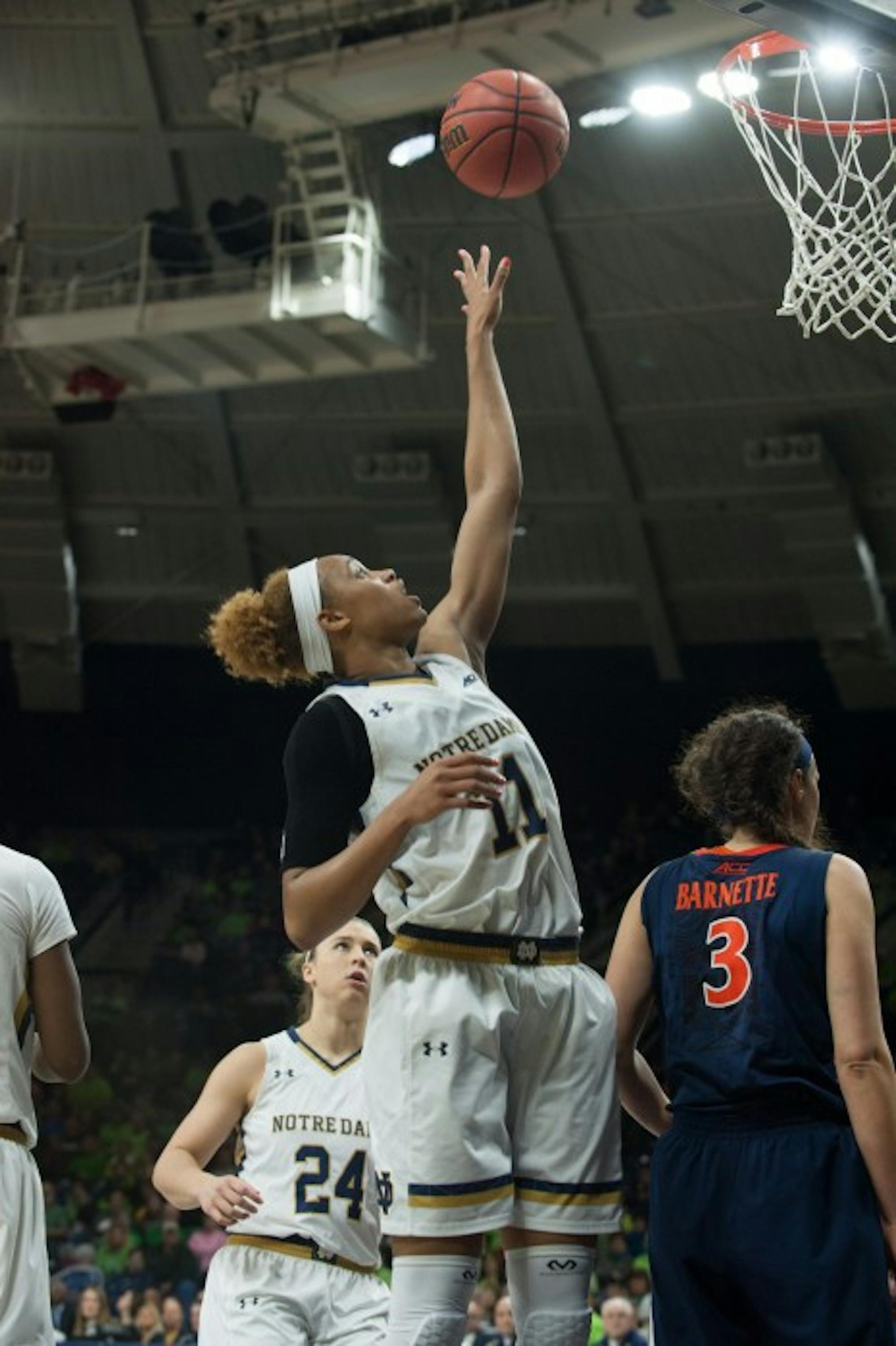 Irish freshman forward Brianna Turner skies for a loose ball after a foul during Notre Dame’s 75-54 win over Virginia on Thursday.