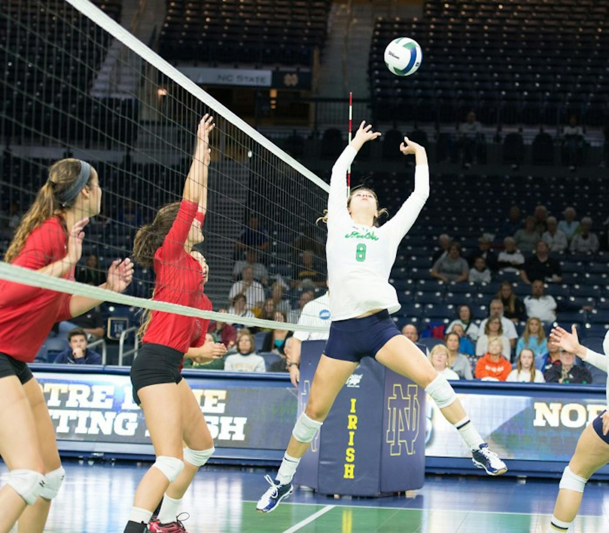 Irish freshman Maddie Dilfer sets the ball in a 3-1 win over Northeastern at home Saturday. The victory came after six consecutive losses to start the season.