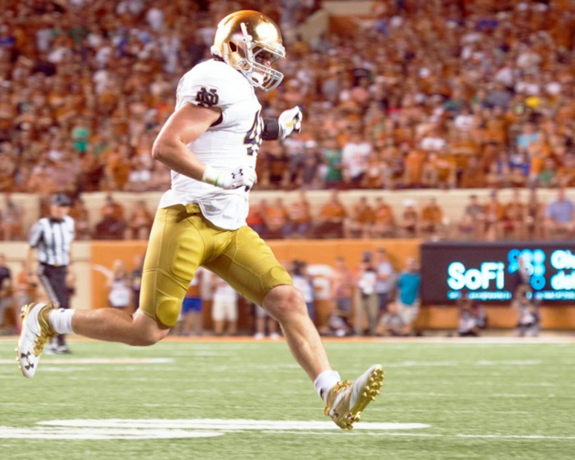 Irish junior linebacker Greer Martini finishes out a play during Notre Dame's 50-47 loss to Texas on Sunday.