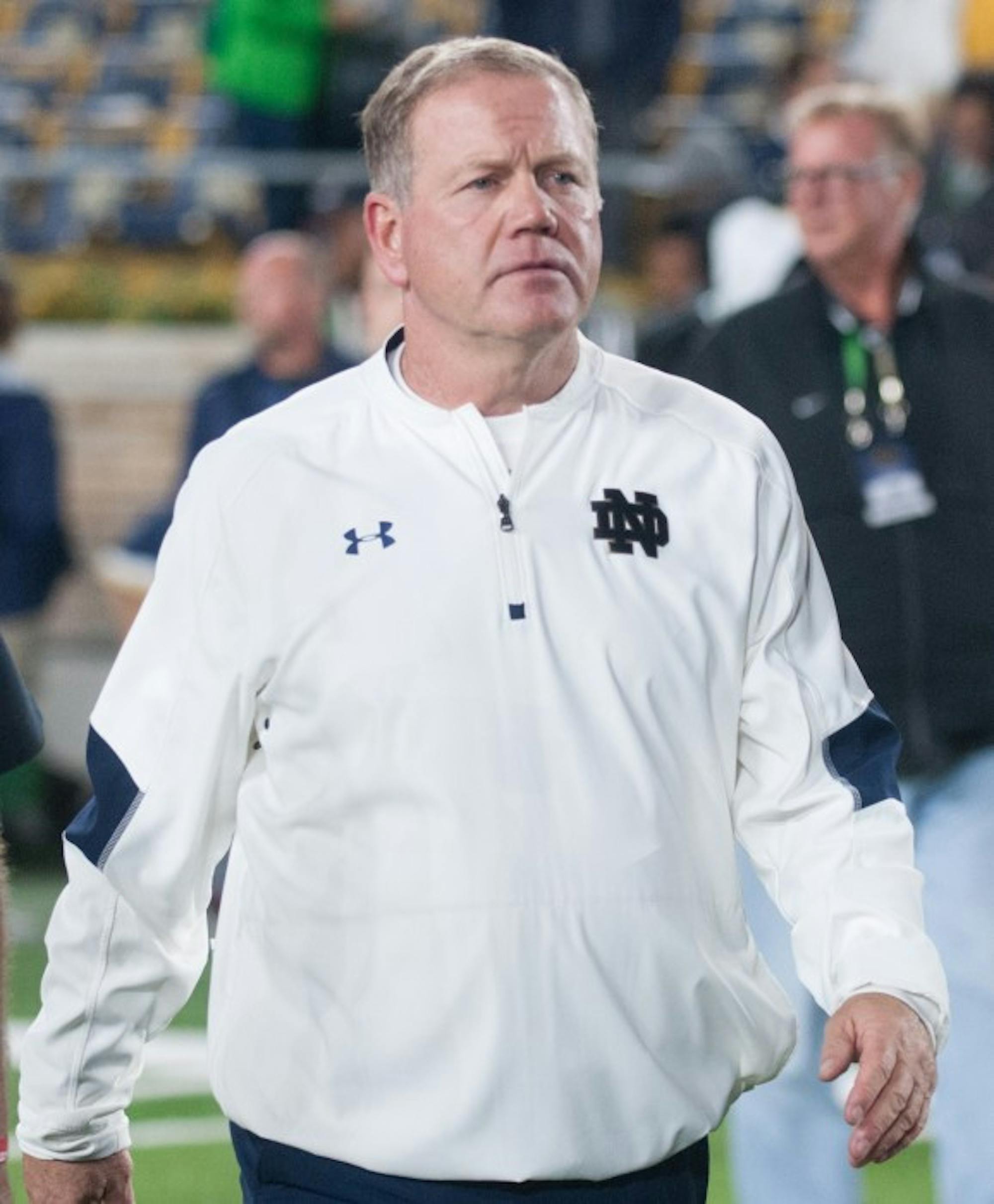 Irish head coach Brian Kelly walks off the field after Notre Dame’s 17-10 loss to Stanford on Oct. 15 at Notre Dame Stadium. Kelly and the Irish have gone 2-7 since Notre Dame lost to Stanford last season.