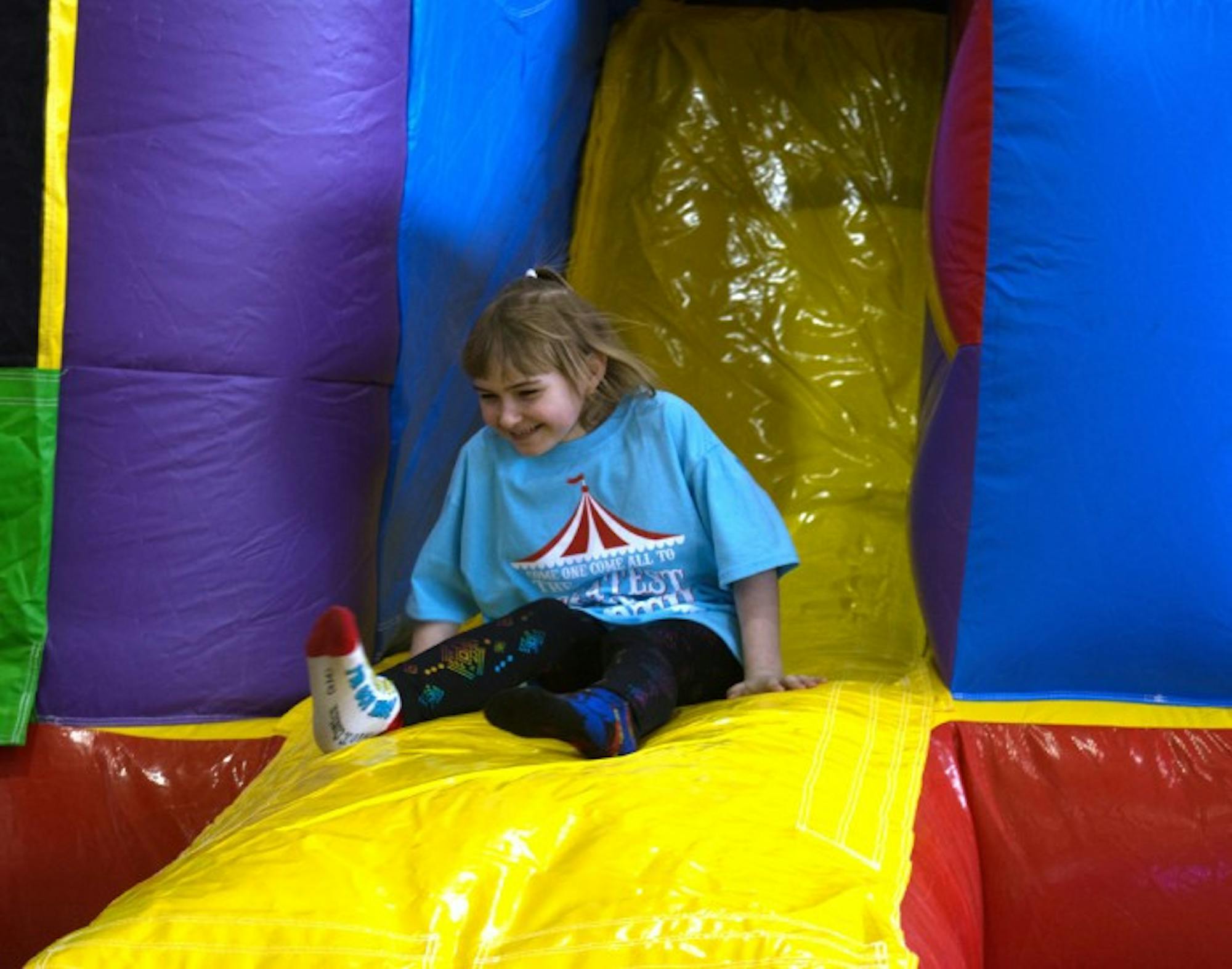 A girl plays on an inflatable slide as part of Saint Mary's annual 12 hour Dance Marathon that supports Riley Hospital for Children.