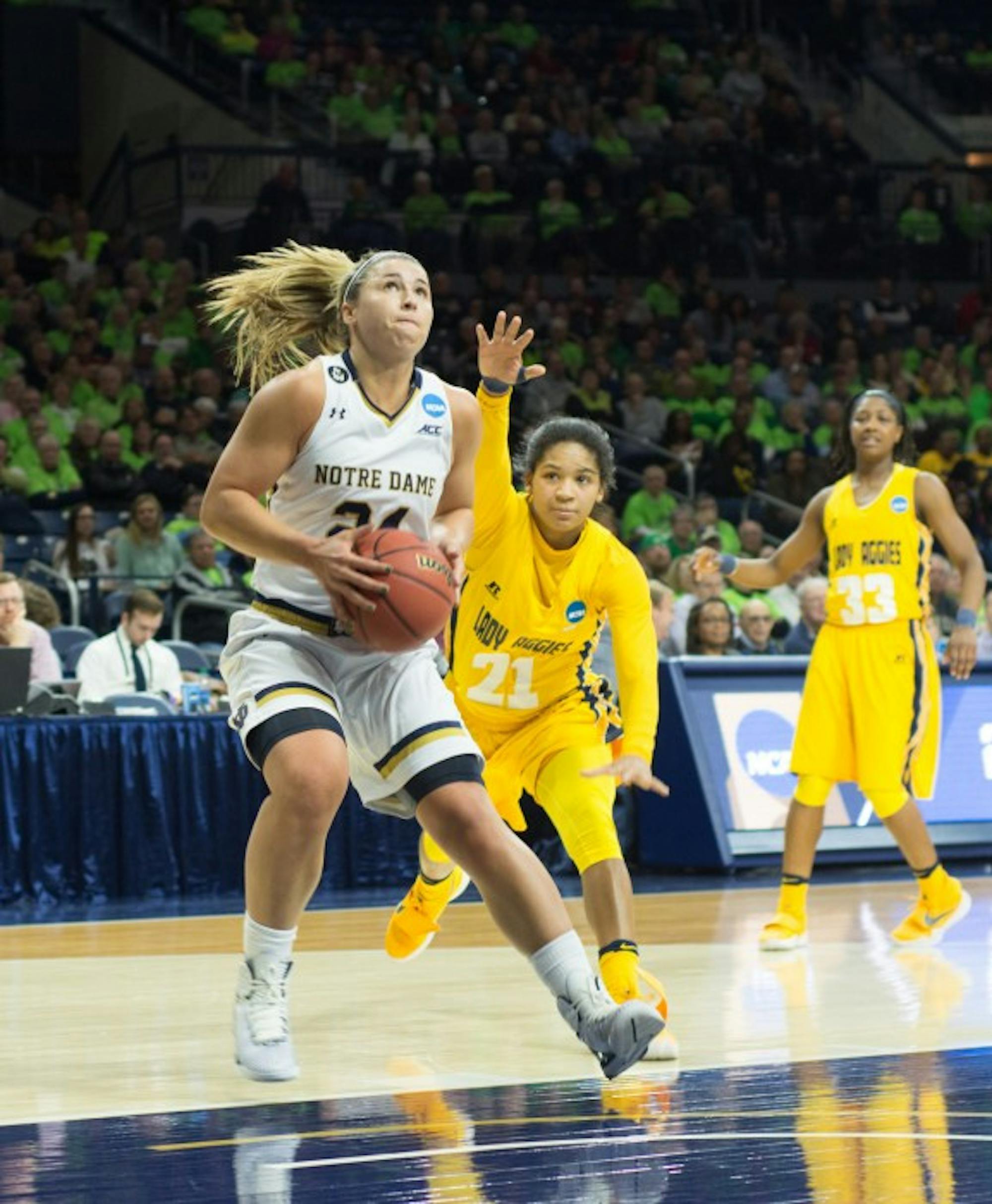 Irish senior guard Hannah Huffman gathers for a shot during Notre Dame's 95-61 victory over North Carolina A&T in the first round of the NCAA tournament on Saturday at Purcell Pavilion.