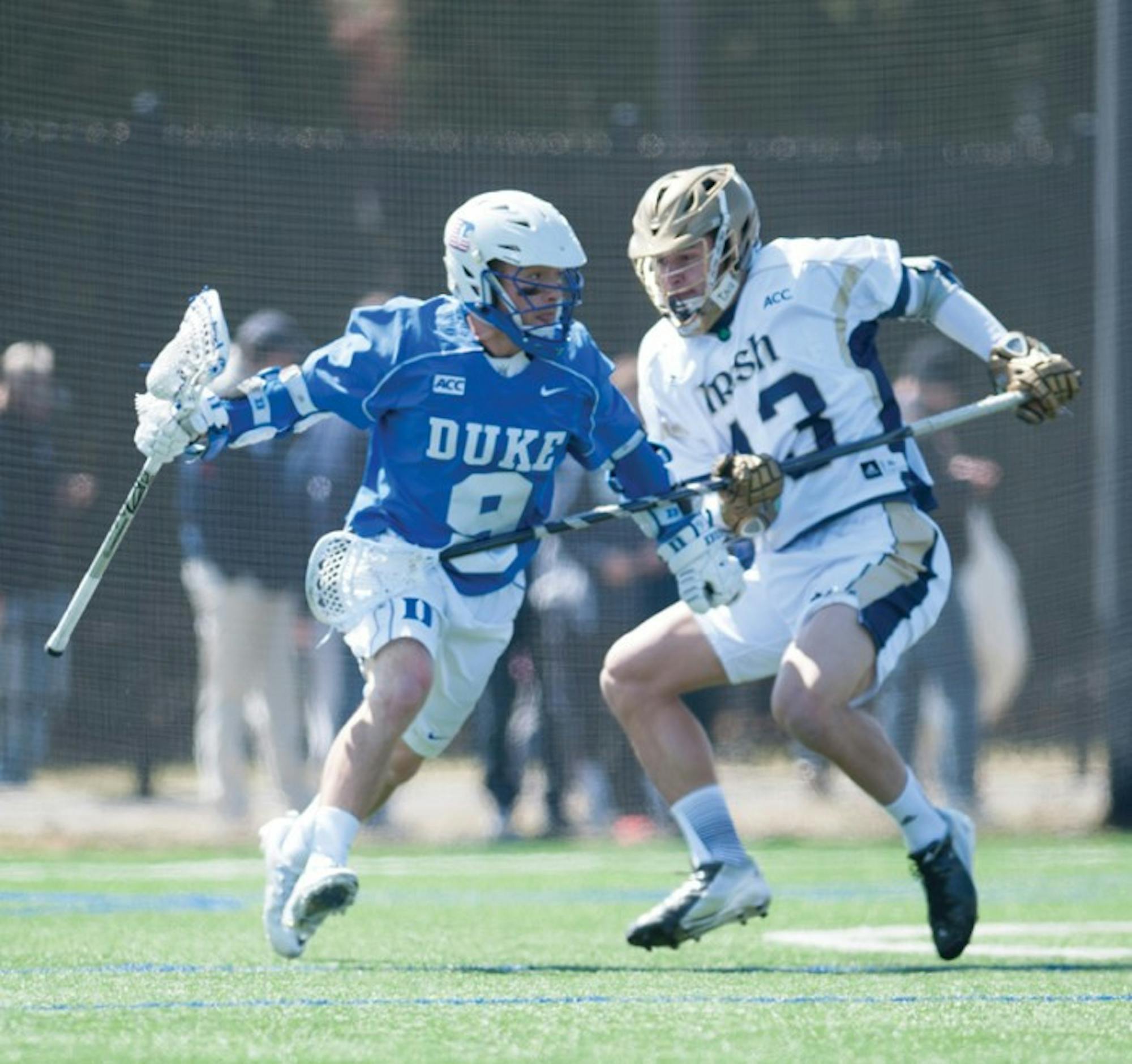Irish senior midfield Tyler Brenneman defends Saturday during Notre Dame’s 15-7 loss to Duke. The defeat dropped the Irish to 2-2 in ACC play.