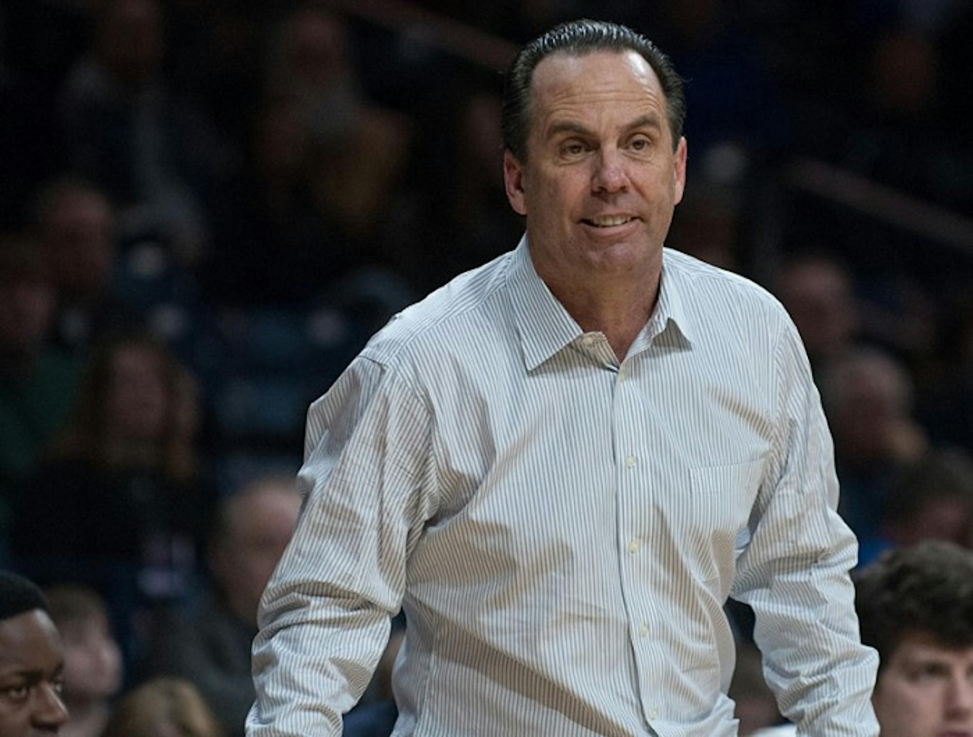 Irish coach Mike Brey observers his team’s game against Boston      College on Saturday. Notre Dame took the 76-73 victory in overtime.