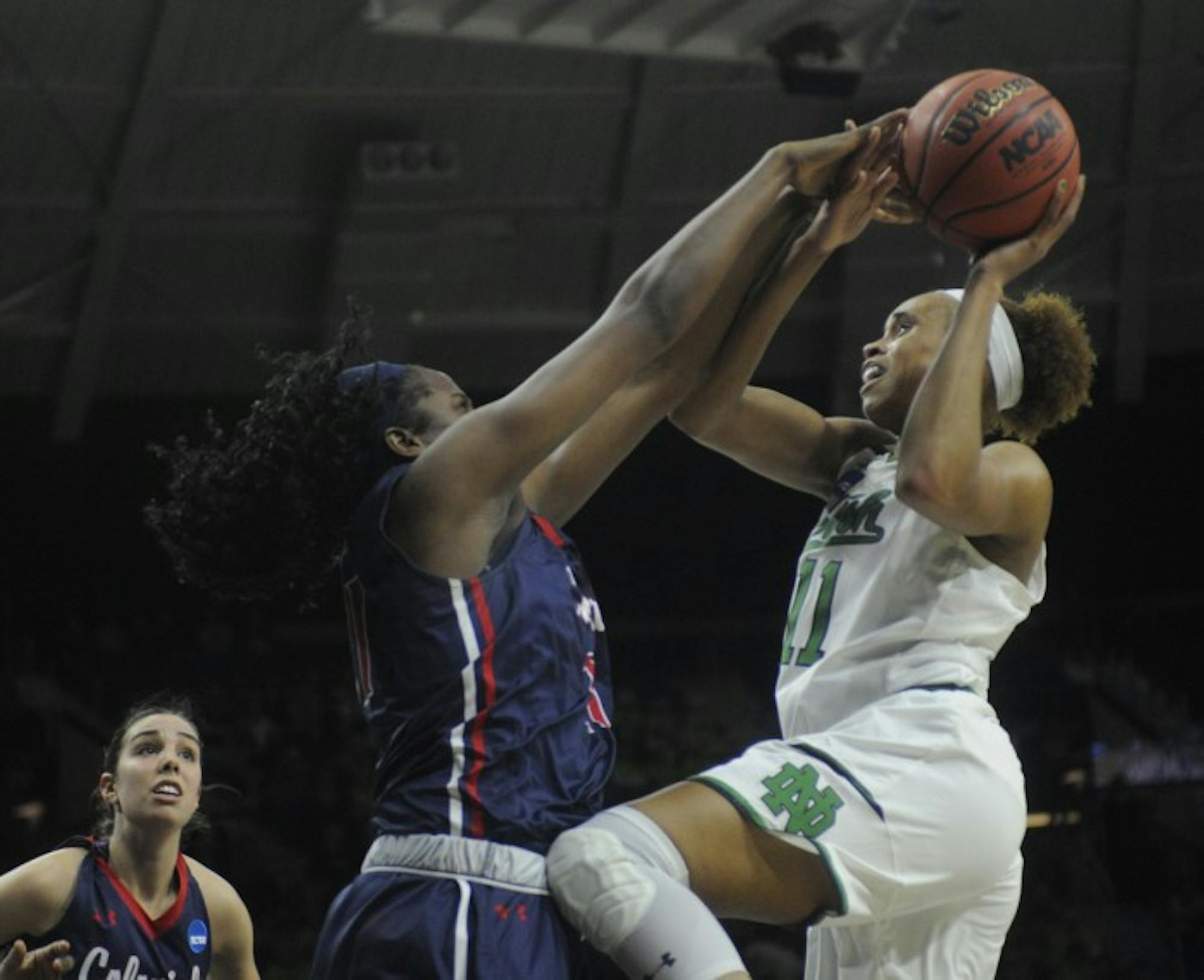 Irish junior forward Brianna Turner fights through contact while attempting a layup during Notre Dame’s 79-49 win over Robert Morris on Friday at Purcell Pavilion.