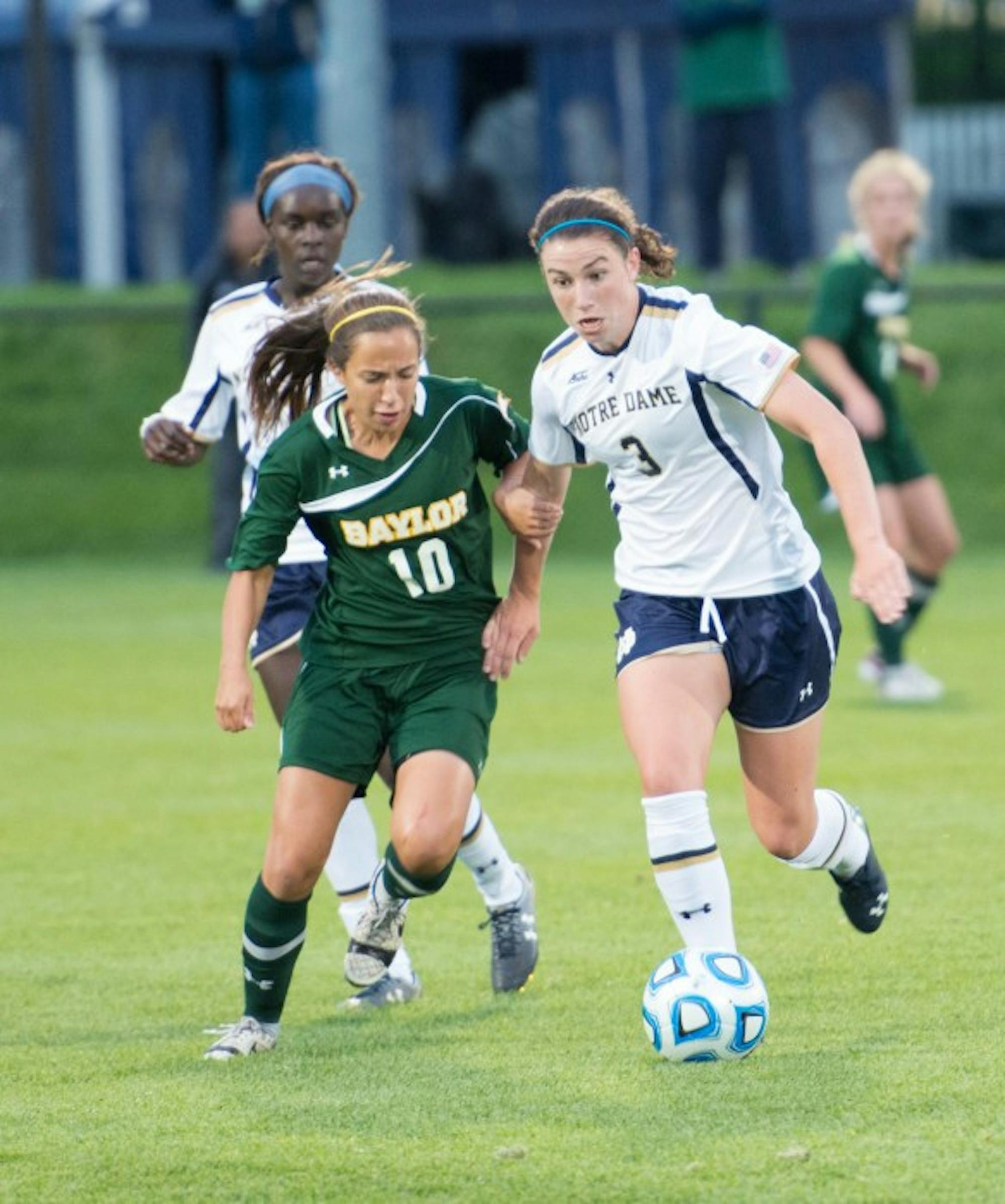 Irish sophomore midfielder Morgan Andrews battles with a defender for the ball during Notre Dame’s 1-0 victory over Baylor on Friday at Alumni Stadium.