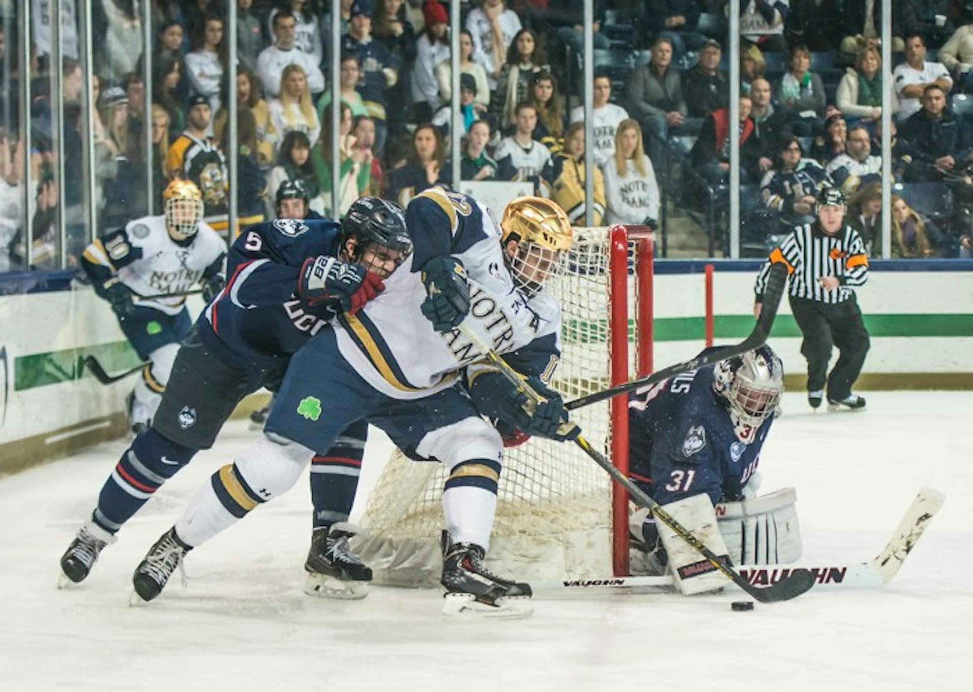 Irish junior left winger Sam Herr attempts to wrap a shot around the net during Notre Dame’s 3-3 tie against Connecticut on Jan. 16.