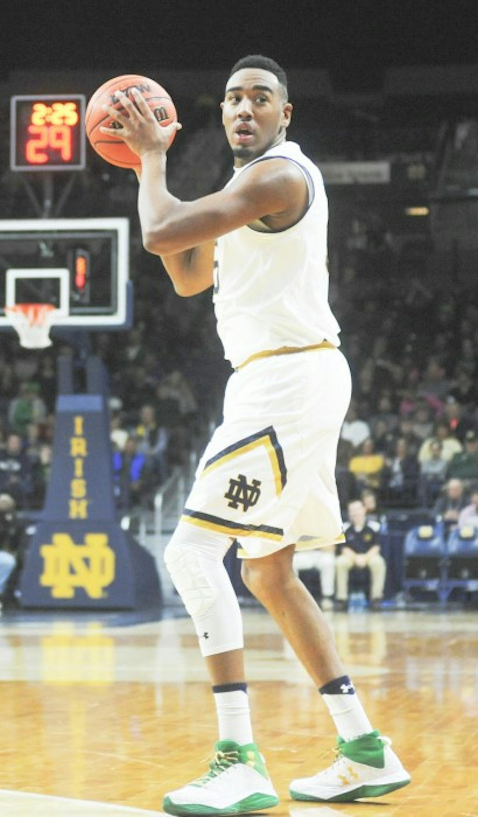 Irish junior forward Bonzie Colson looks to swing the ball around the perimeter during Notre Dame’s 89-64 win over Bryant on Saturday at Purcell Pavilion.