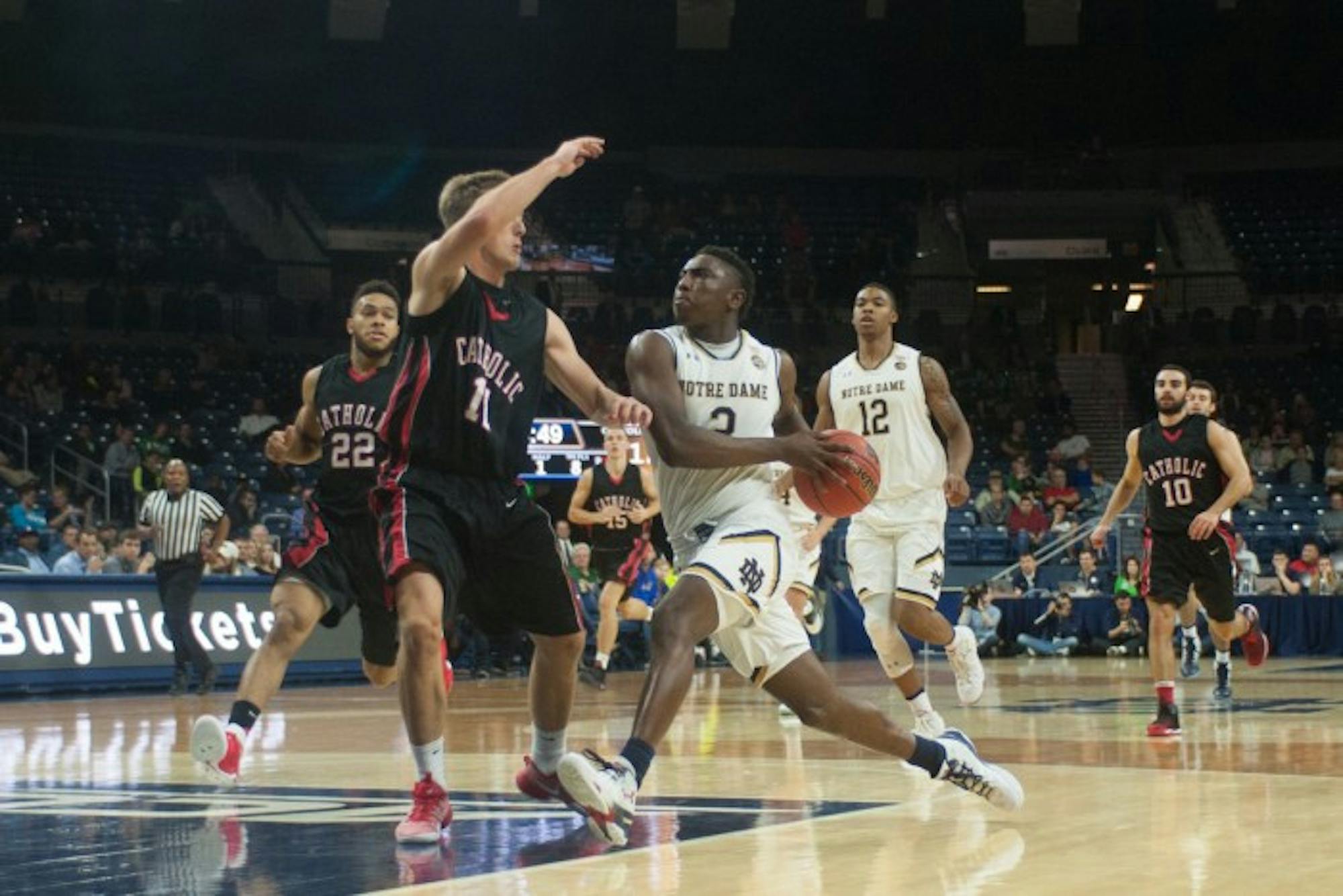 Irish freshman guard T.J. Gibbs drives toward the basket in Notre Dame's 103-48 victory over Catholic on Monday.