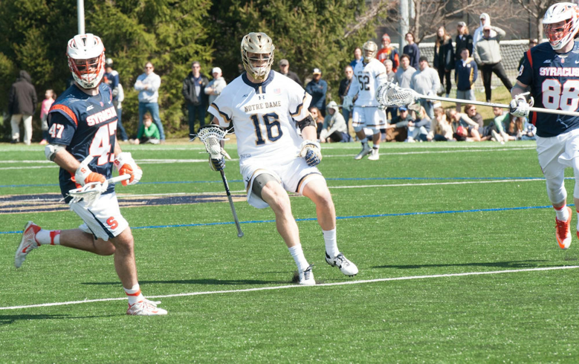 Irish senior captain midfielder Sergio Perkovic cradles the ball during Notre Dame’s 11-10 loss to Syracuse on Saturday at Arlotta Stadium. Perkovic tallied one goal and two assists in the game.