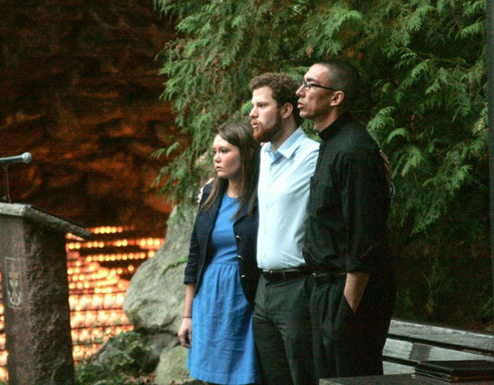 Nancy Joyce, Alex Coccia and Fr. Pete McCormick lead a prayer service Sept. 22, 2013, in response to a sexual assault report.