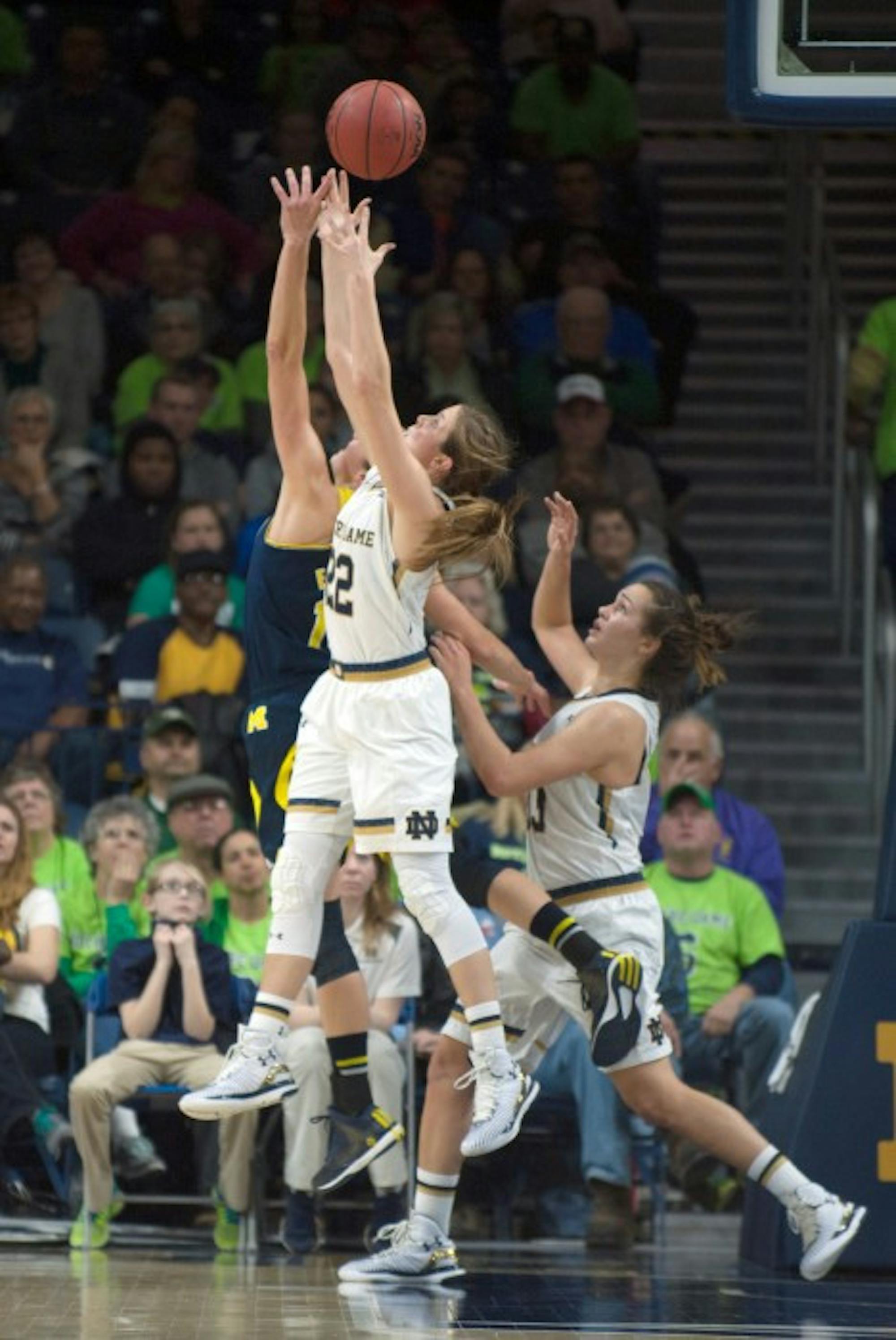 Irish senior guard Madison Cable out-jumps a Michigan opponent for a loose ball during Notre Dame’s 70-50 win Dec. 13.