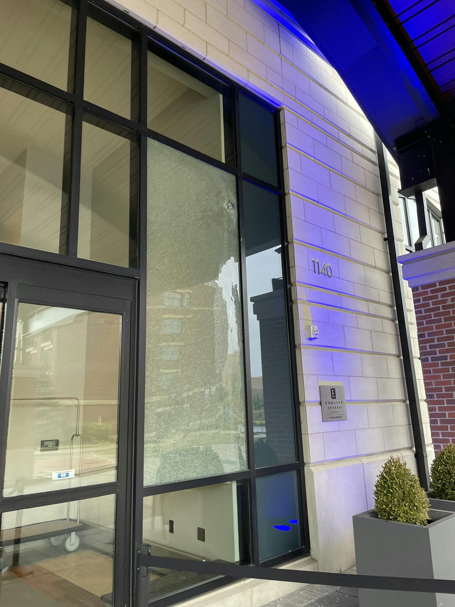 Window seen shattered at Embassy Suites hotel following shots fired