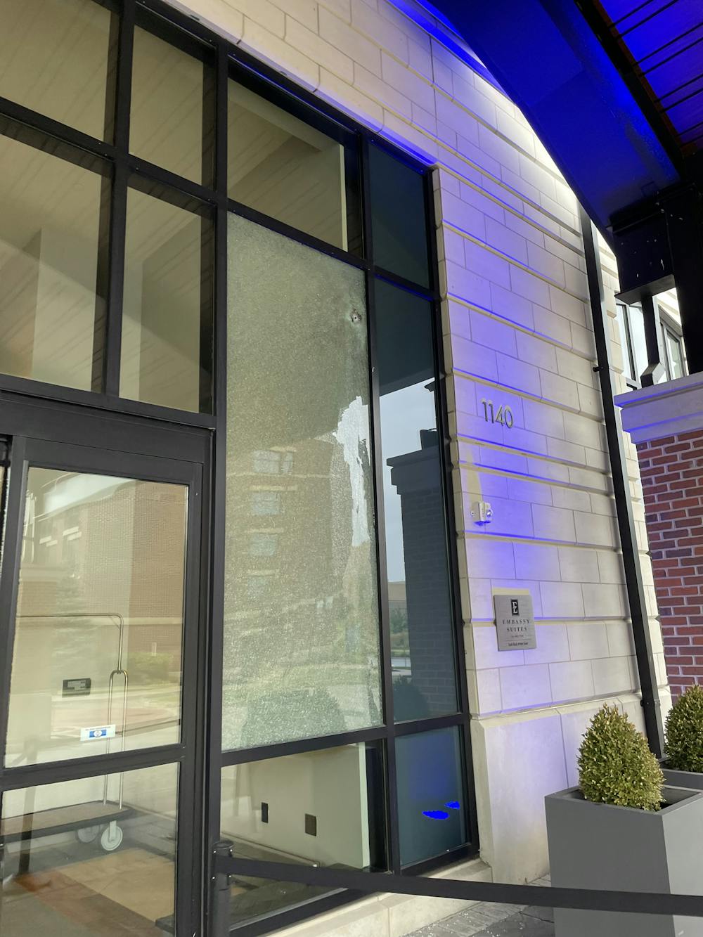 Window seen shattered at Embassy Suites hotel following shots fired
