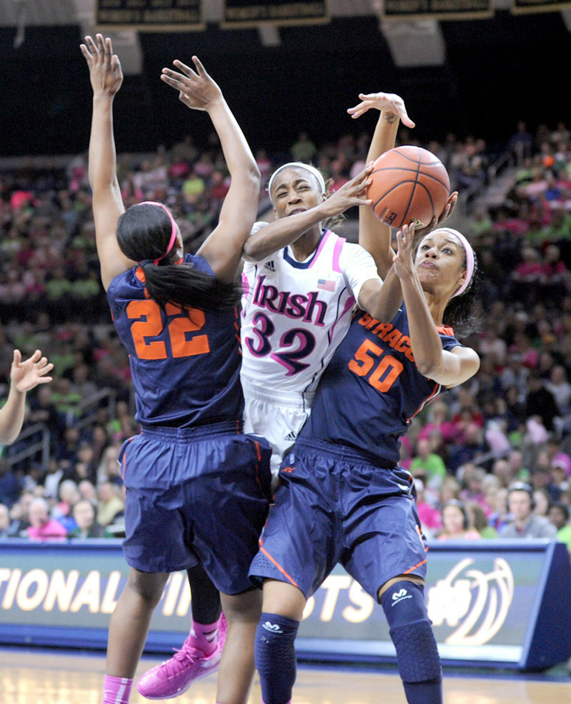 Irish sophomore guard Jewell Loyd tries to split two defenders during Notre Dame’s 101-64 victory over the Orange on Feb. 9. Loyd leads all Irish scorers with 18.8 points per game.