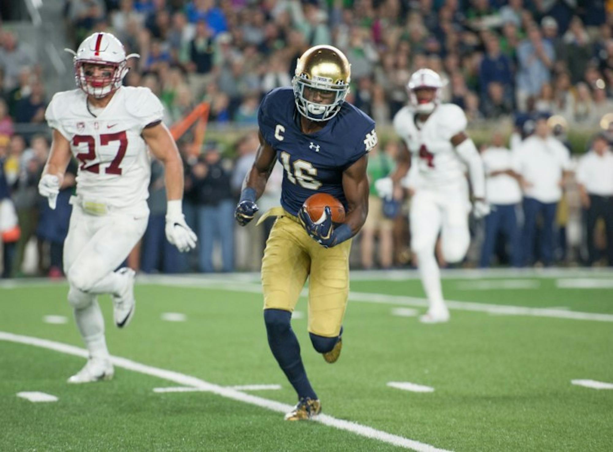 Irish senior receiver Torii Hunter Jr. looks to pick up more yards after a catch during Notre Dame’s 17-10 loss to Stanford on Oct. 15.