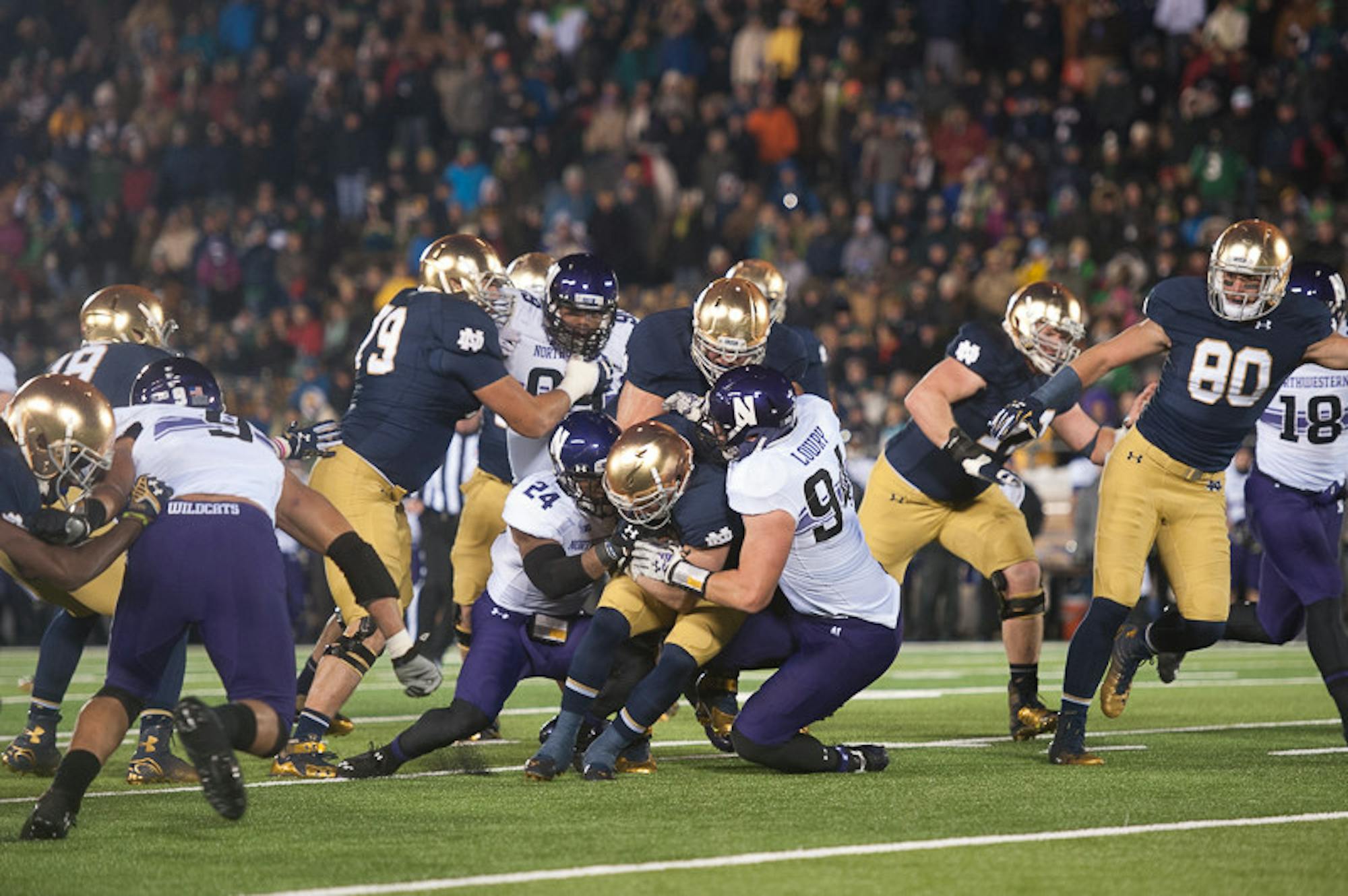 Irish senior running back Cam McDaniel fumbles in the fourth quarter of Northwestern’s 43-40  overtime victory over Notre Dame on Saturday at Notre Dame Stadium.