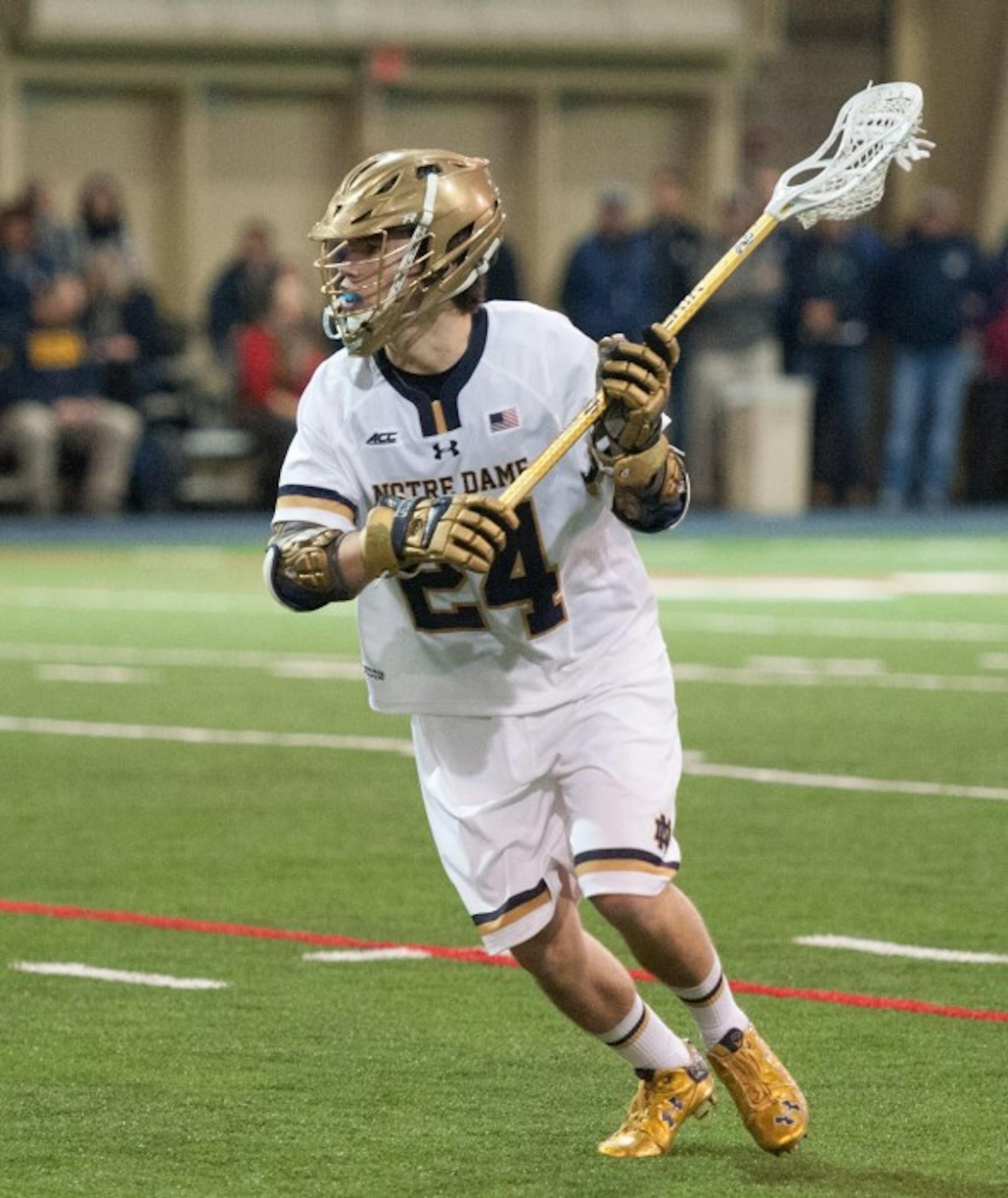 Irish freshman attack Mikey Wynne searches for an opening during Notre Dame’s 14-12 win over Georgetown on Saturday.