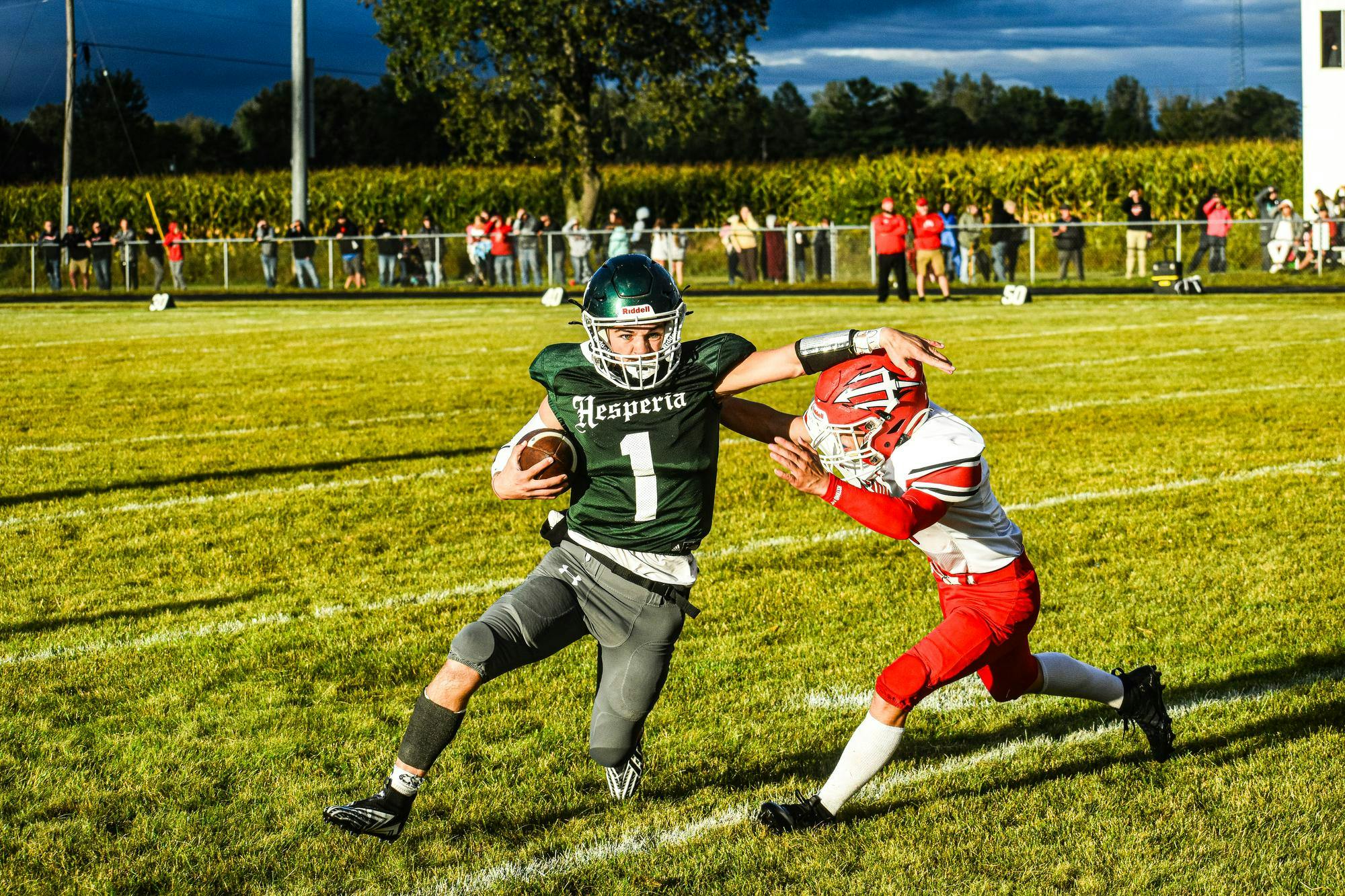 Hesperia FB vs. Holton (Week 2) - Blake Sayer stiff arm.jpg