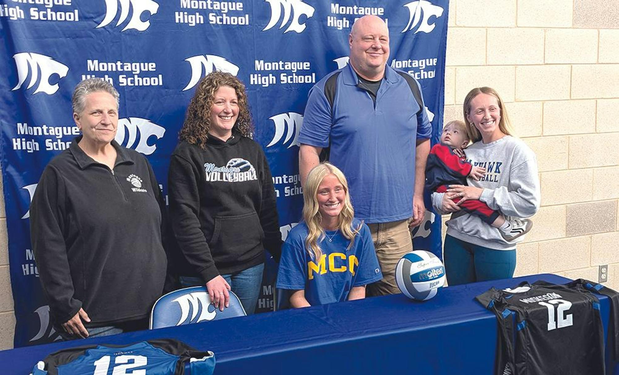 montague signing reagan cederquist.jpg
