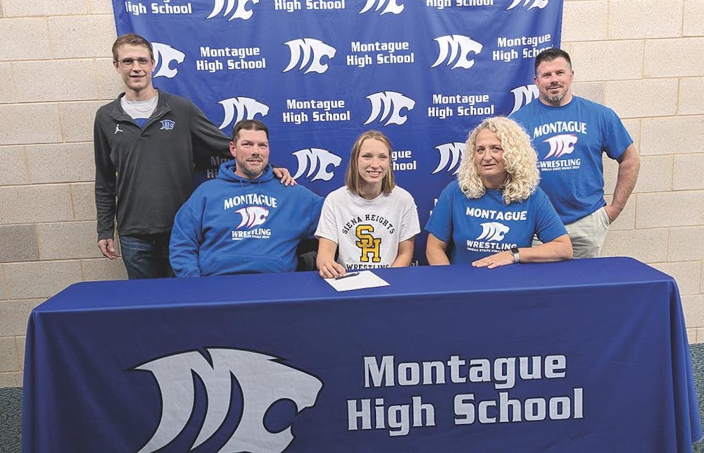 college signing emma.jpg